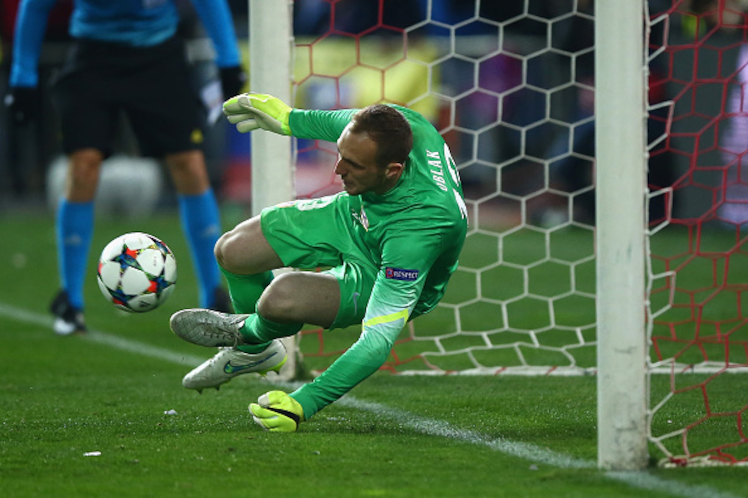 MADRID, SPAIN - MARCH 17:  Jan Oblak of Atletico Madrid makes a save in the penalty shoot out during the UEFA Champions League round of 16 match between Club Atletico de Madrid and Bayer 04 Leverkusen at Vicente Calderon Stadium on March 17, 2015 in Madri