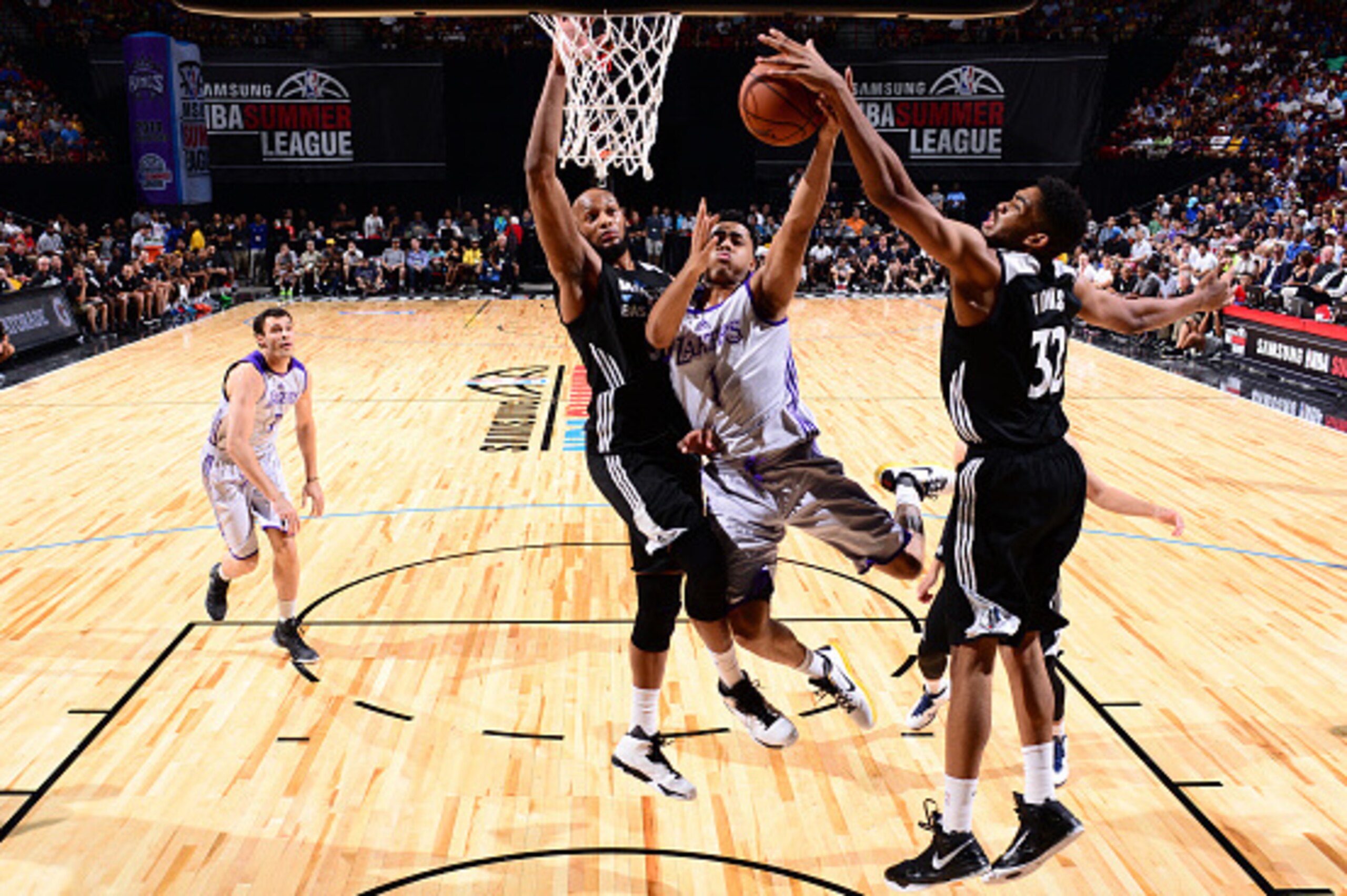 LAS VEGAS, NV - JULY 10: Karl-Anthony Towns #32 of the Minnesota Timberwolves blocks D'Angelo Russell #1 of the Los Angeles Lakers lay up during NBA Summer League on July 10, 2012 at Cox Pavilion in Las Vegas, Nevada. NOTE TO USER: User expressly acknowle