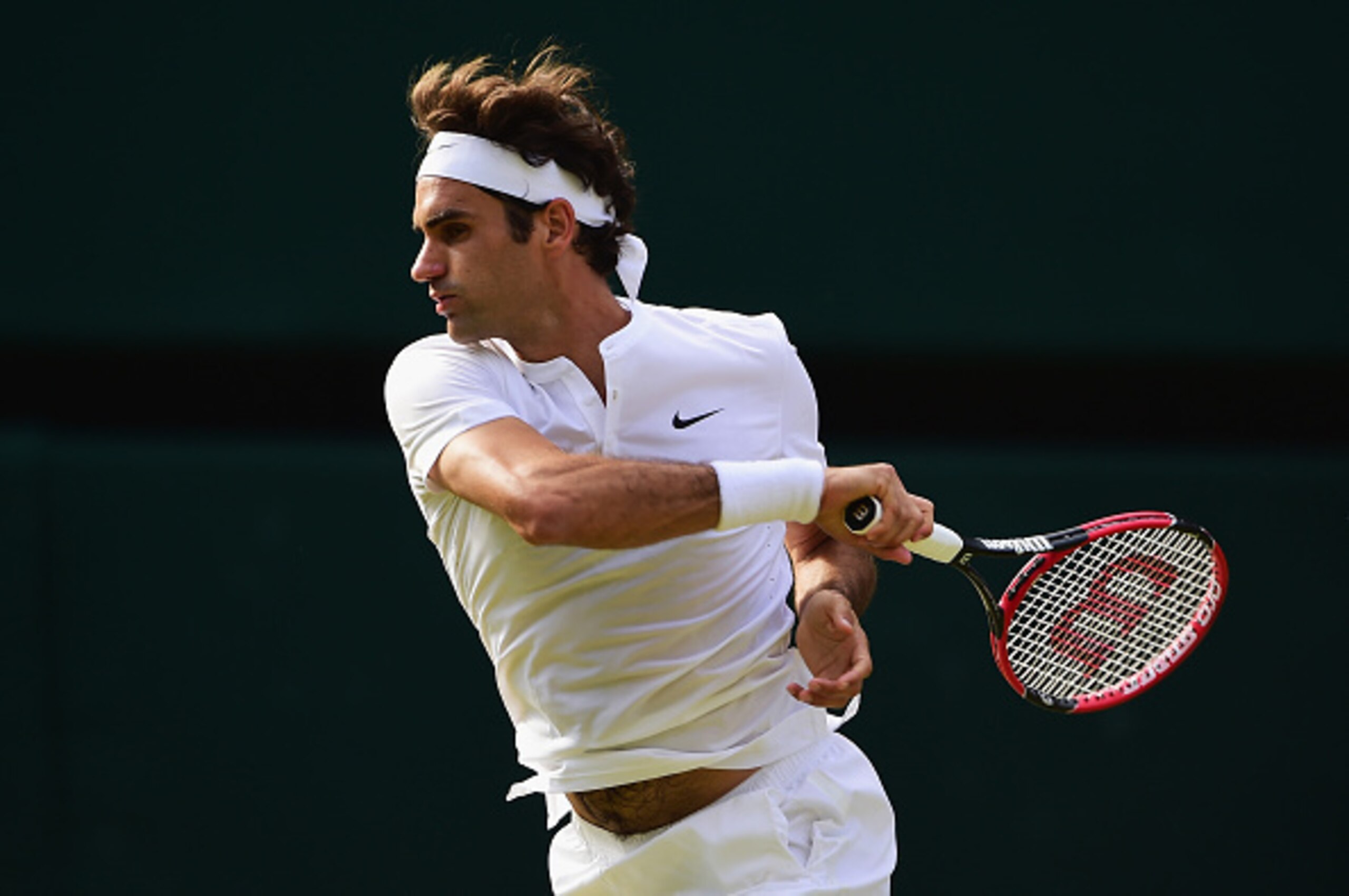 LONDON, ENGLAND - JULY 10:  Roger Federer of Switzerland plays a forehand in the Gentlemens Singles Semi Final match against Andy Murray of Great Britain during day eleven of the Wimbledon Lawn Tennis Championships at the All England Lawn Tennis and Croqu