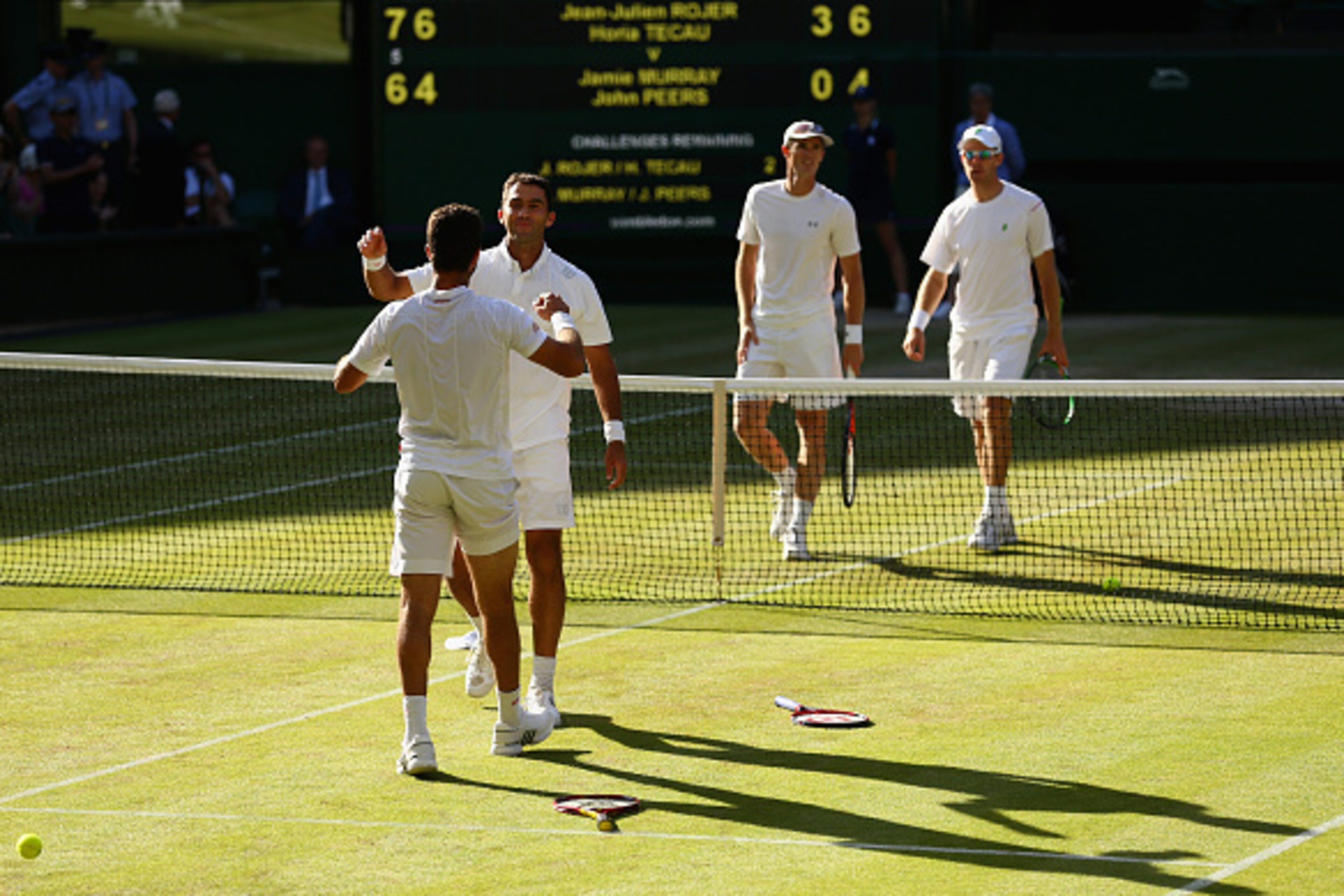 LONDON, ENGLAND - JULY 11:  Jean-Julien Rojer of Netherlands and Horia Tecau of Romania celebrate after winning the Final Of The Gentlemen's Doubles against John Peers of Australia and Jamie Murray of Great Britain during day twelve of the Wimbledon Lawn 