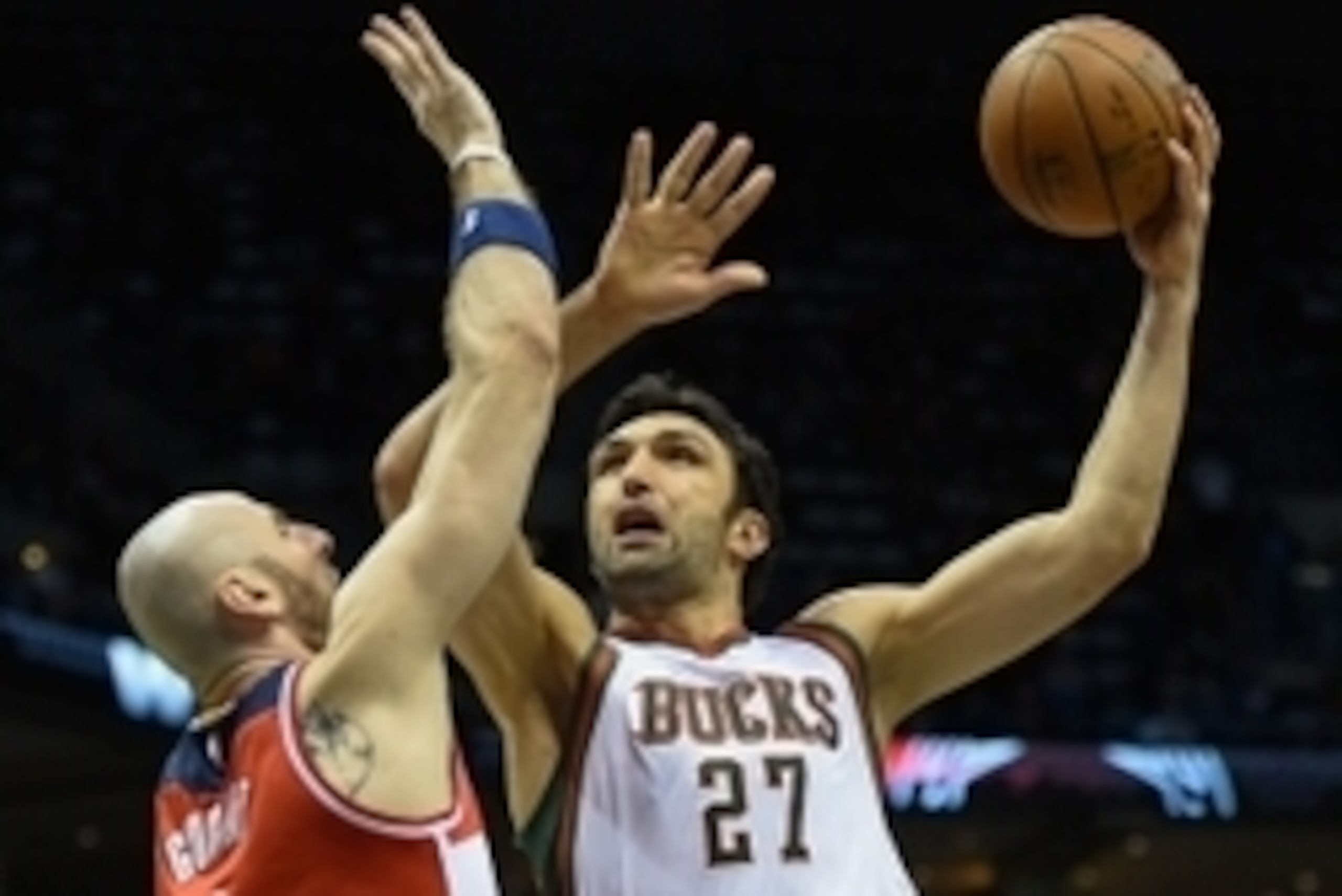 Mar 7, 2015; Milwaukee, WI, USA;  Milwaukee Bucks center Zaza Pachulia (27) takes a shot against Washington Wizards center Marcin Gortat (4) in the third quarter at BMO Harris Bradley Center. Mandatory Credit: Benny Sieu-USA TODAY Sports