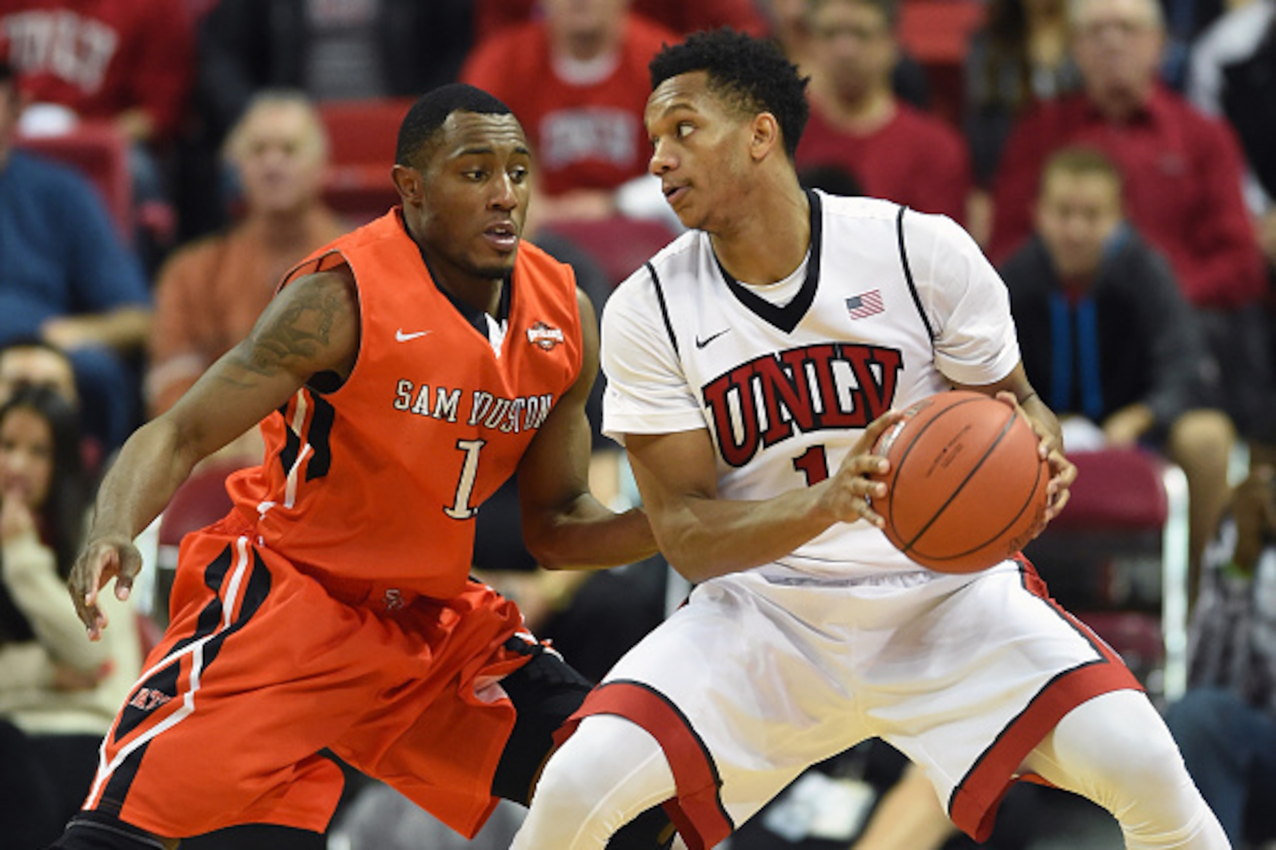 LAS VEGAS, NV - NOVEMBER 16:  Rashad Vaughn #1 of the UNLV Rebels is guarded by Jabari Peters #1 of the Sam Houston State Bearkats during their game at the Thomas & Mack Center on November 16, 2014 in Las Vegas, Nevada. UNLV won 59-57.  (Photo by Ethan Mi