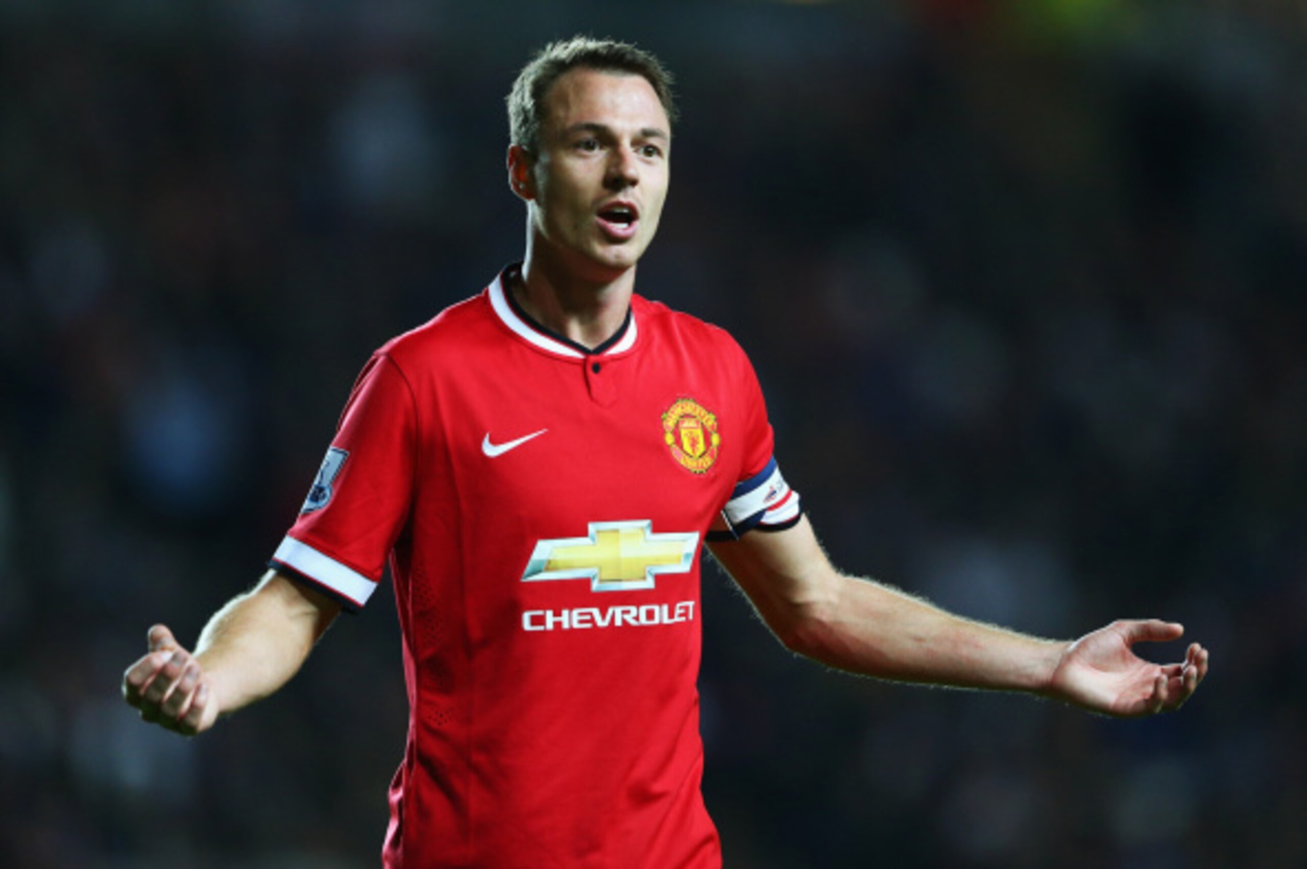 MILTON KEYNES, ENGLAND - AUGUST 26: Jonny Evans of Manchester United shows his frustration during the Capital One Cup Second Round match between MK Dons and Manchester United at Stadium mk on August 26, 2014 in Milton Keynes, England.  (Photo by Clive Mas