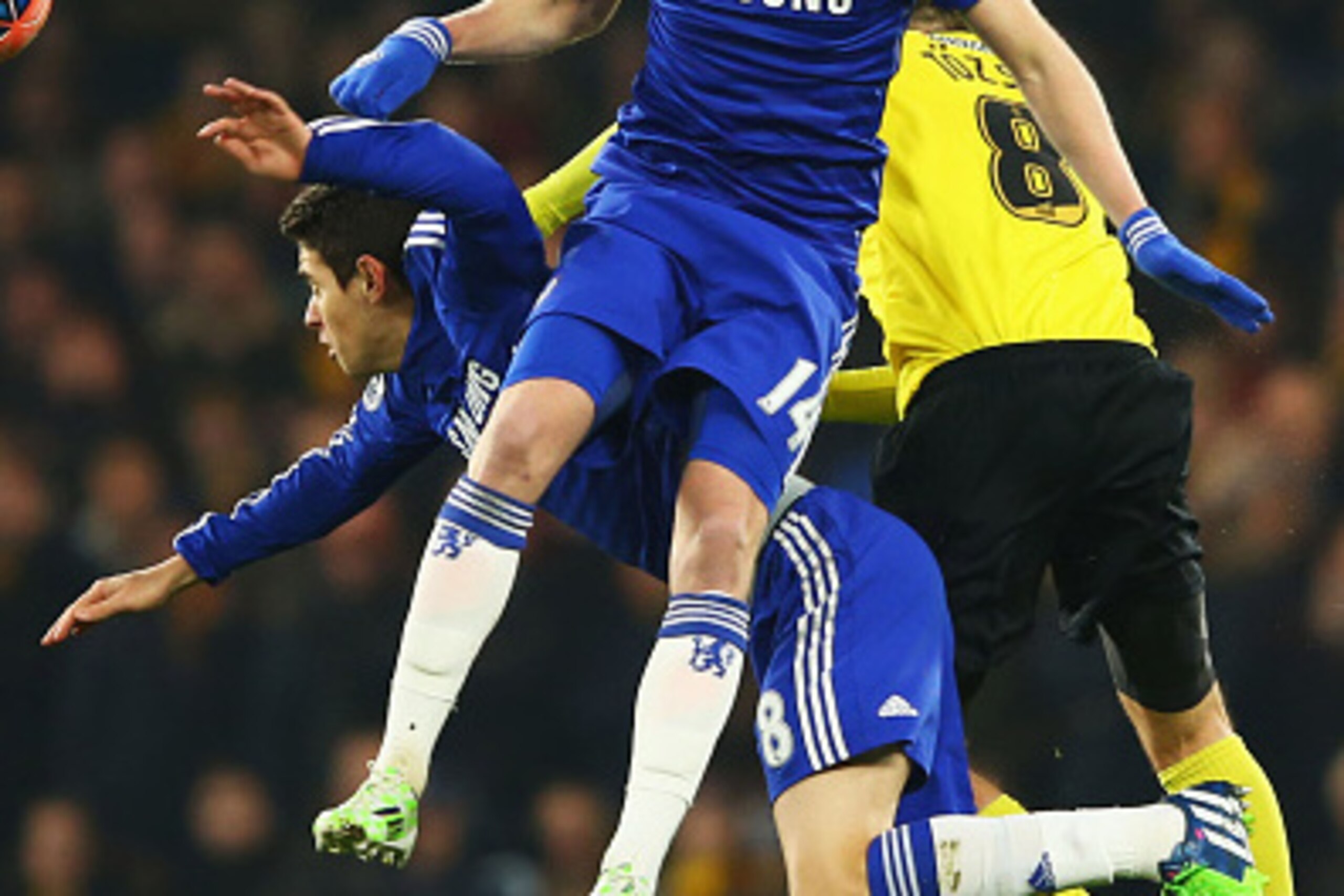 LONDON, ENGLAND - JANUARY 04:  (L-R) Oscar and Andre Schuerrle of Chelsea and Daniel Tozser of Watford jump for the ball during the FA Cup Third Round match between Chelsea and Watford at Stamford Bridge on January 4, 2015 in London, England.  (Photo by R