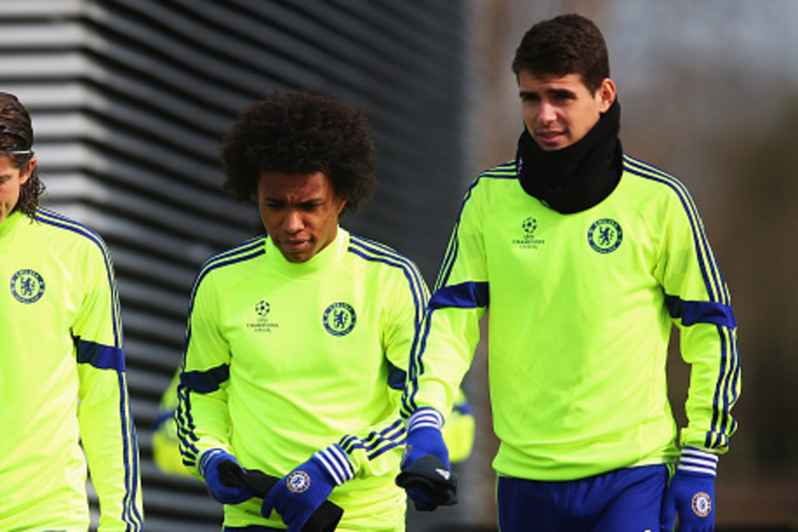 COBHAM, ENGLAND - MARCH 10:  (L-R) Filipe Luis, Willian and Oscar look on during a Chelsea training session ahead of the UEFA Champions League Round of 16 second leg match against Paris Saint-Germain at Chelsea Training Ground on March 10, 2015 in Cobham,