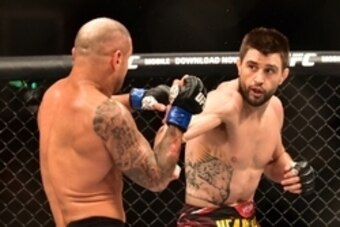 May 30, 2015; Goiania, GO, Brazil; Carlos Condit (red gloves) fights Thiago Alves (blue gloves) during UFC Fight Night at Goiania Arena. Mandatory Credit: Jason Silva-USA TODAY Sports