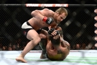 Jul 11, 2015; Las Vegas, NV, USA; Gunnar Nelson (red gloves) and Brandon Thatch (blue gloves) fight during UFC 189 at MGM Grand Garden Arena. Nelson won via first round submision. Mandatory Credit: Joe Camporeale-USA TODAY Sports