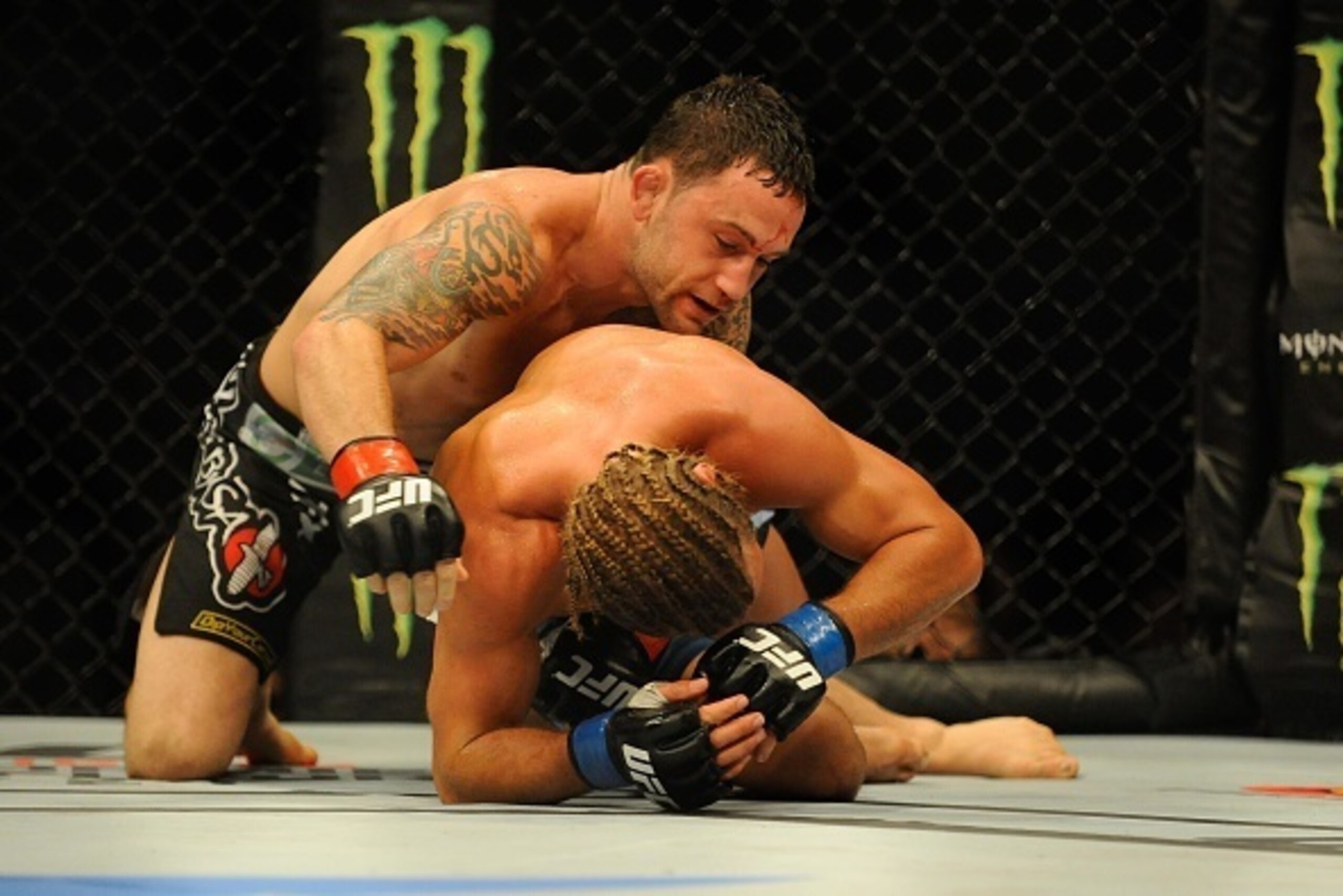 MANILA, PHILIPPINES - MAY 16:  Uriah Faber grapples with Frankie Edgar in their featherweight bout during the UFC Fight Night event at the Mall Of Asia Arena on May 16, 2015 in Manila, Philippines.  (Photo by Dondi Tawatao/Getty Images)