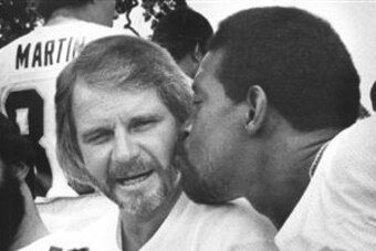 Stabler gets a peck on the cheek from Gene Upshaw.