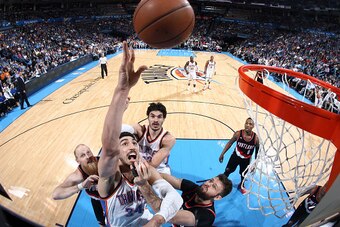 OKLAHOMA CITY, OK- APRIL 13: Enes Kanter #34 of the Oklahoma City Thunder shoots against the Portland Trail Blazers on April 13, 2015 at Chesapeake Energy Arena in Oklahoma City, Oklahoma. NOTE TO USER: User expressly acknowledges and agrees that, by down