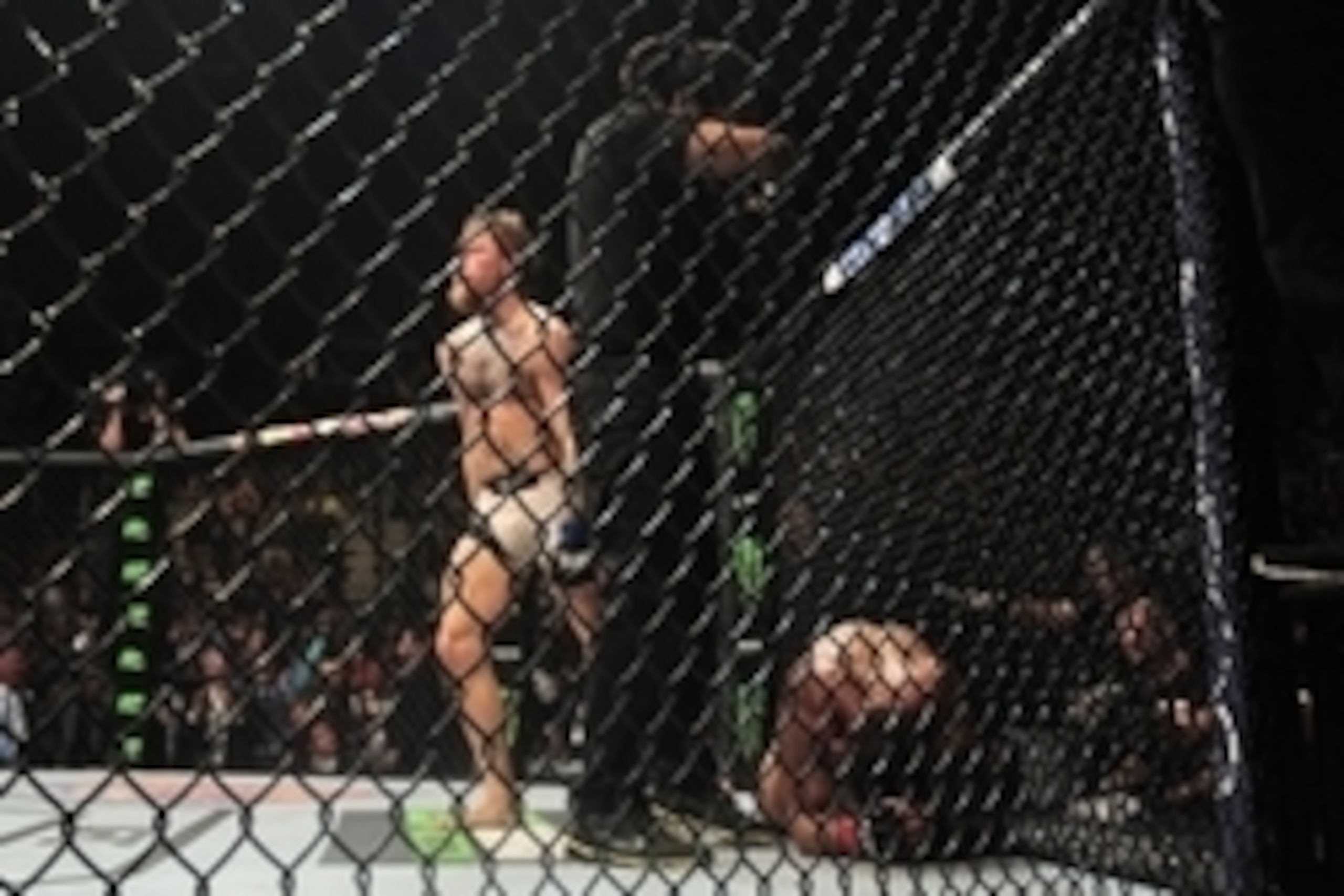 Jul 11, 2015; Las Vegas, NV, USA; Chad Mendes (red gloves) is knocked out by Conor McGregor (blue gloves) during their interim featherweight title bout during UFC 189 at MGM Grand Garden Arena. McGregor won via second round TKO. Mandatory Credit: Joe Camp