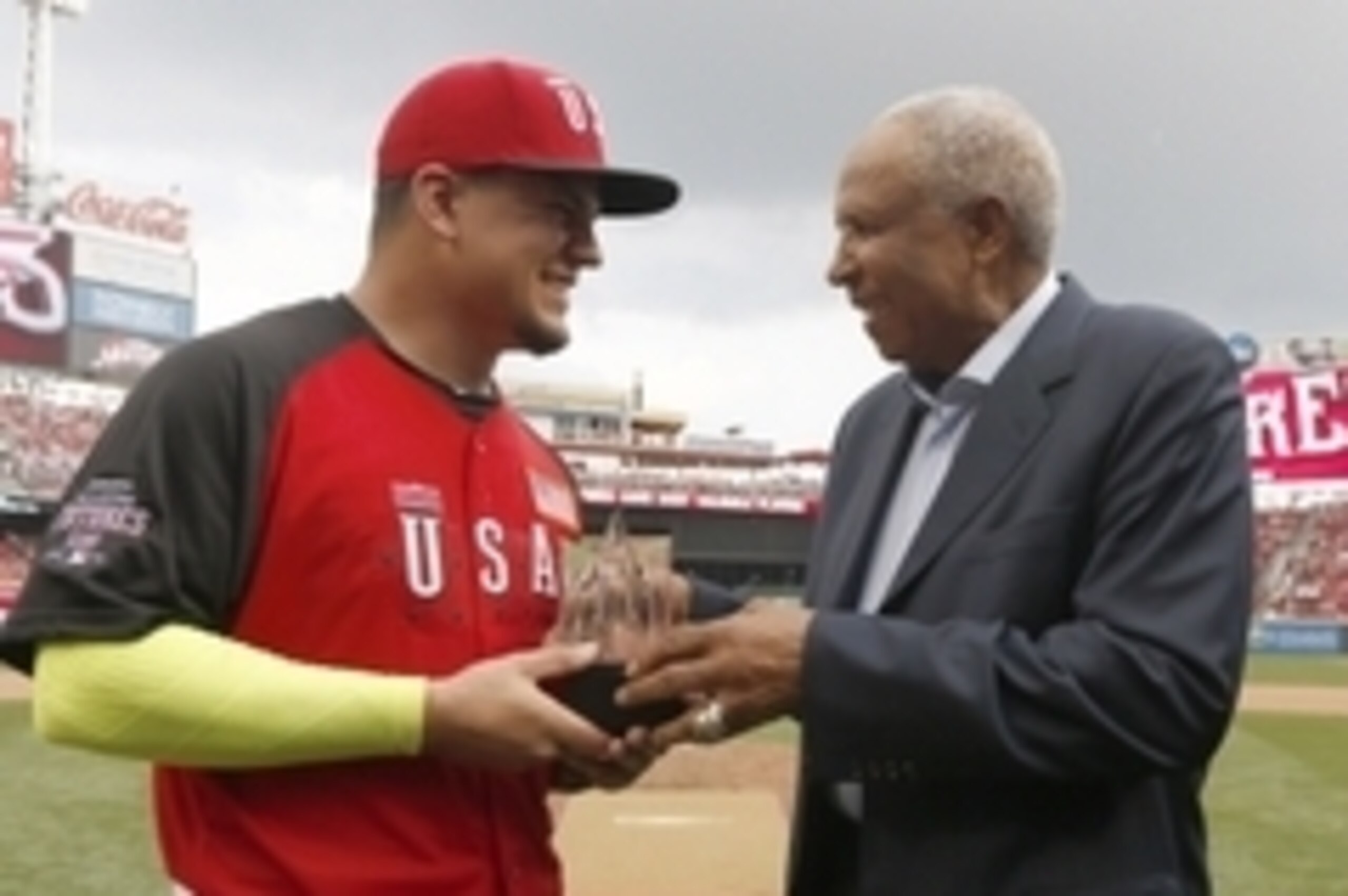 Jul 12, 2015; Cincinnati, OH, USA; USA catcher Kyle Schwarber (left) is presented the MVP trophy from baseball great Frank Robinson (right) after the All Star Futures Game with the World Team at Great American Ballpark. Mandatory Credit: David Kohl-USA T Jul 12, 2015; Cincinnati, OH, USA; USA catcher Kyle Schwarber (left) is presented the MVP trophy from baseball great Frank Robinson (right) after the All Star Futures Game with the World Team at Great American Ballpark. Mandatory Credit: David Kohl-USA T
