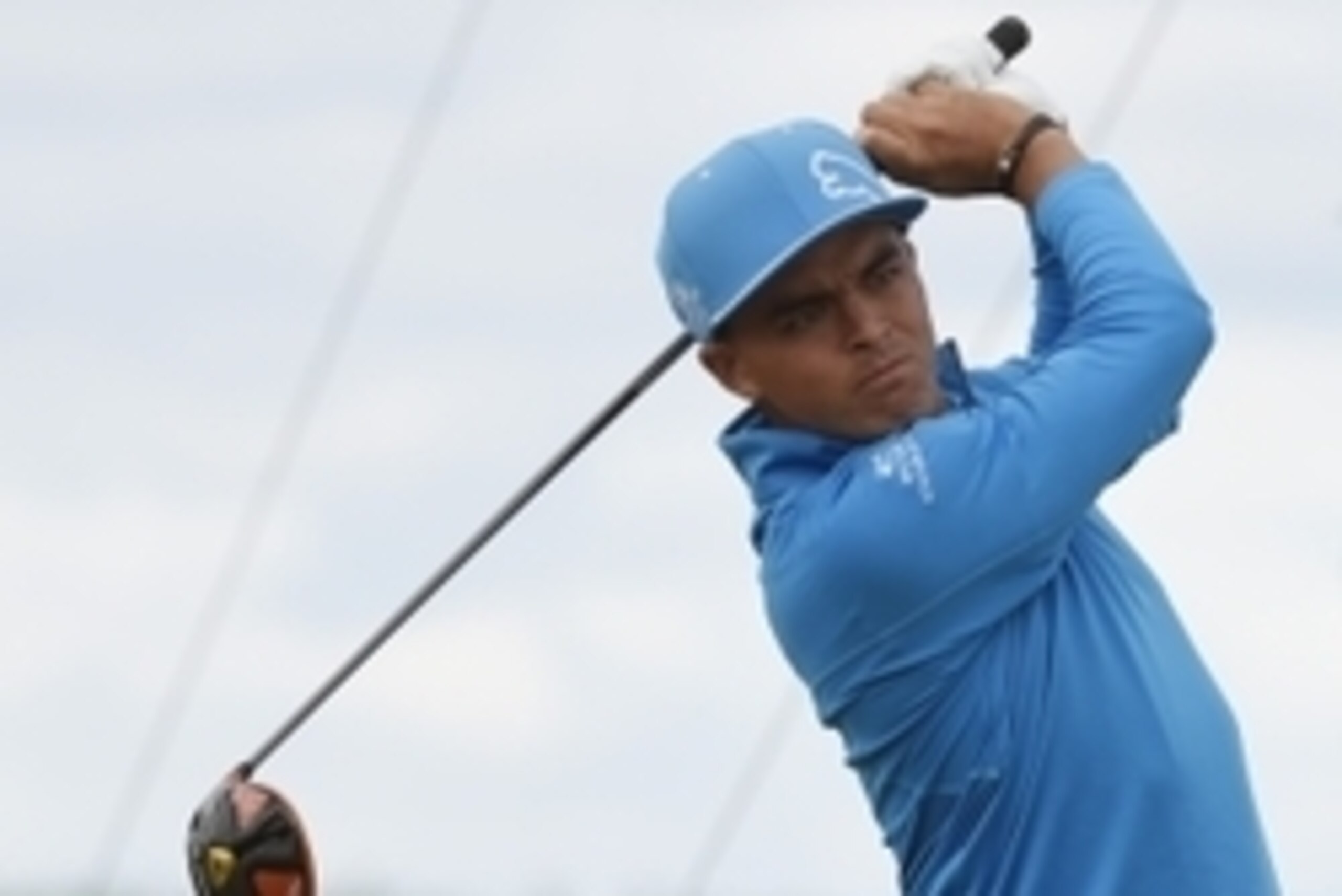 Jun 19, 2015; University Place, WA, USA; Rickie Fowler hits his tee shot on the 12th hole in the second round of the 2015 U.S. Open golf tournament at Chambers Bay. Mandatory Credit: Michael Madrid-USA TODAY Sports
