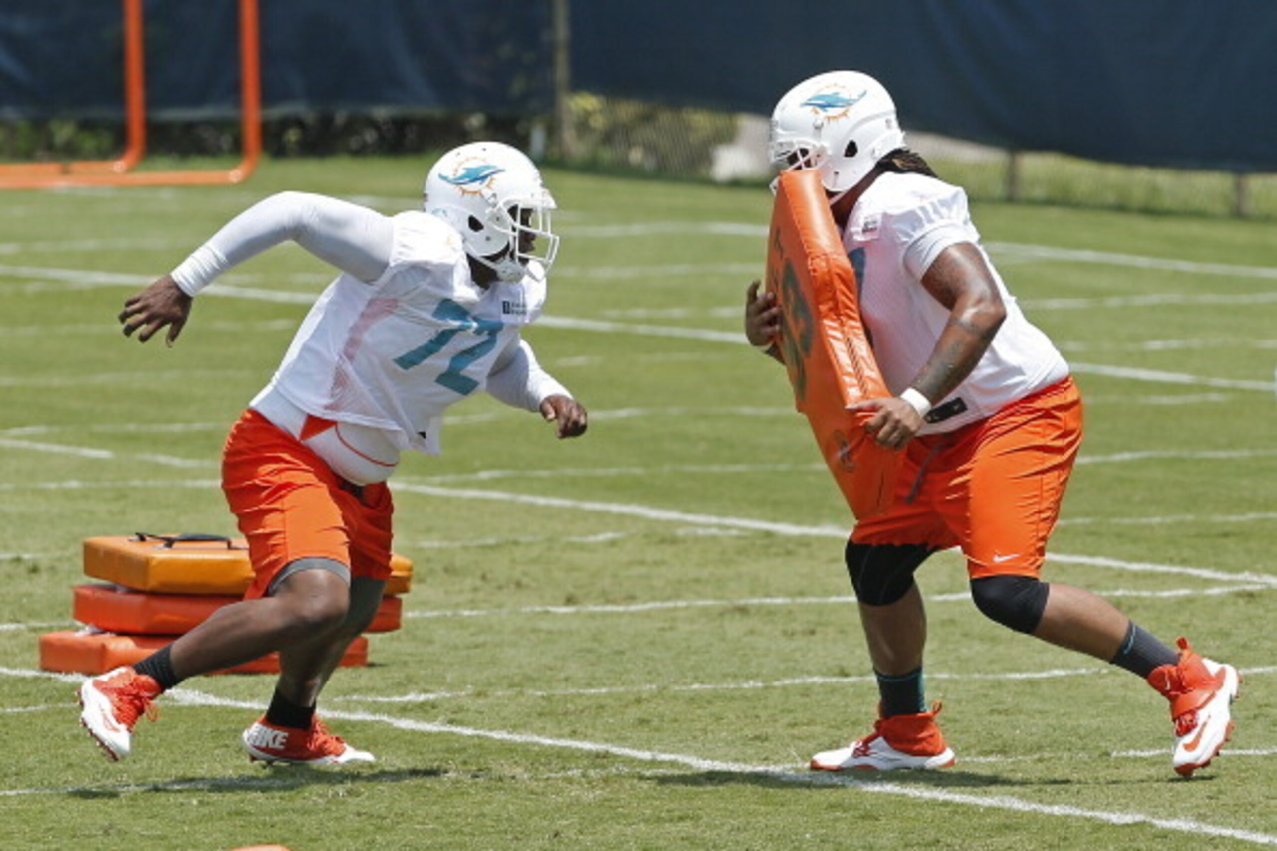 DAVIE, FL - MAY 23: Ja'Wuan James #72 and Billy Turner #77 of the Miami Dolphins participate in drills during the rookie minicamp on May 23, 2014 at the Miami Dolphins training facility in Davie, Florida. (Photo by Joel Auerbach/Getty Images)