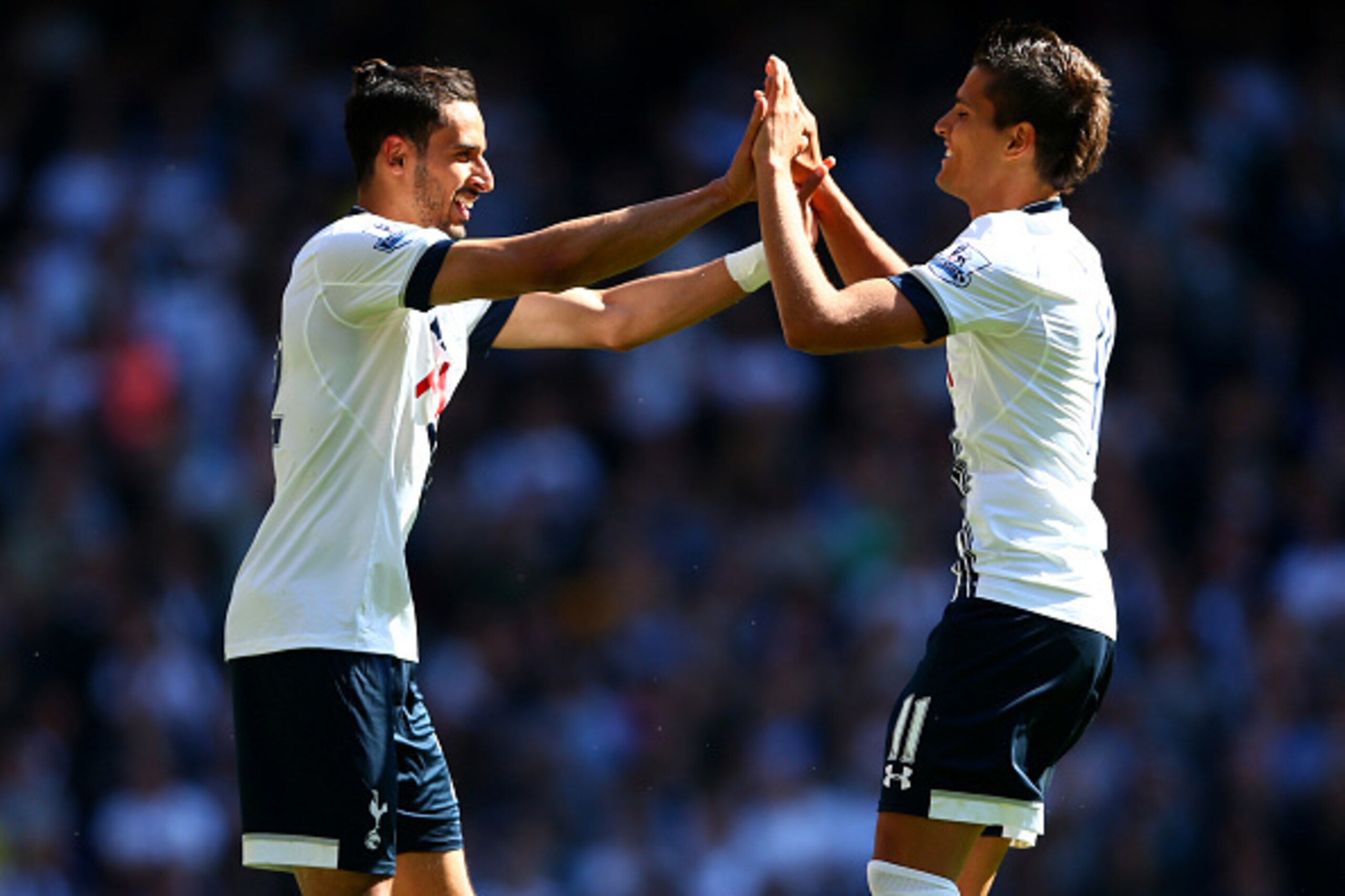 LONDON, ENGLAND - MAY 16: Nacer Chadli (L) of Spurs celebrates scoring his team's first goal with his team mate Erik Lamela during the Barclays Premier League match between Tottenham Hotspur and Hull City at White Hart Lane on May 16, 2015 in London, Eng LONDON, ENGLAND - MAY 16: Nacer Chadli (L) of Spurs celebrates scoring his team's first goal with his team mate Erik Lamela during the Barclays Premier League match between Tottenham Hotspur and Hull City at White Hart Lane on May 16, 2015 in London, Eng