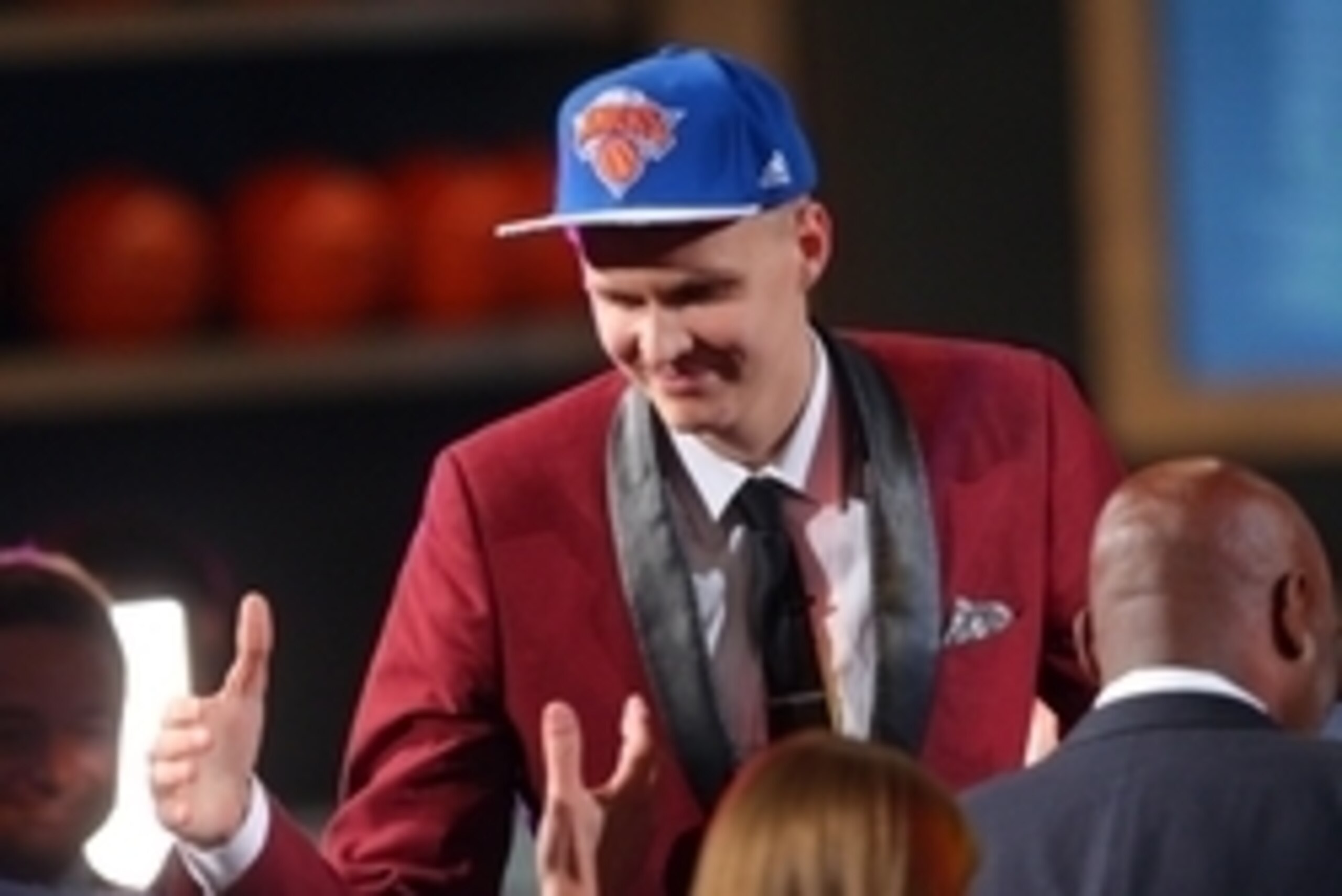 Jun 25, 2015; Brooklyn, NY, USA; Kristaps Porzingis (SPN) reacts after being selected as the number four overall pick to the Miami Heat in the first round of the 2015 NBA Draft at Barclays Center. Mandatory Credit: Brad Penner-USA TODAY Sports
