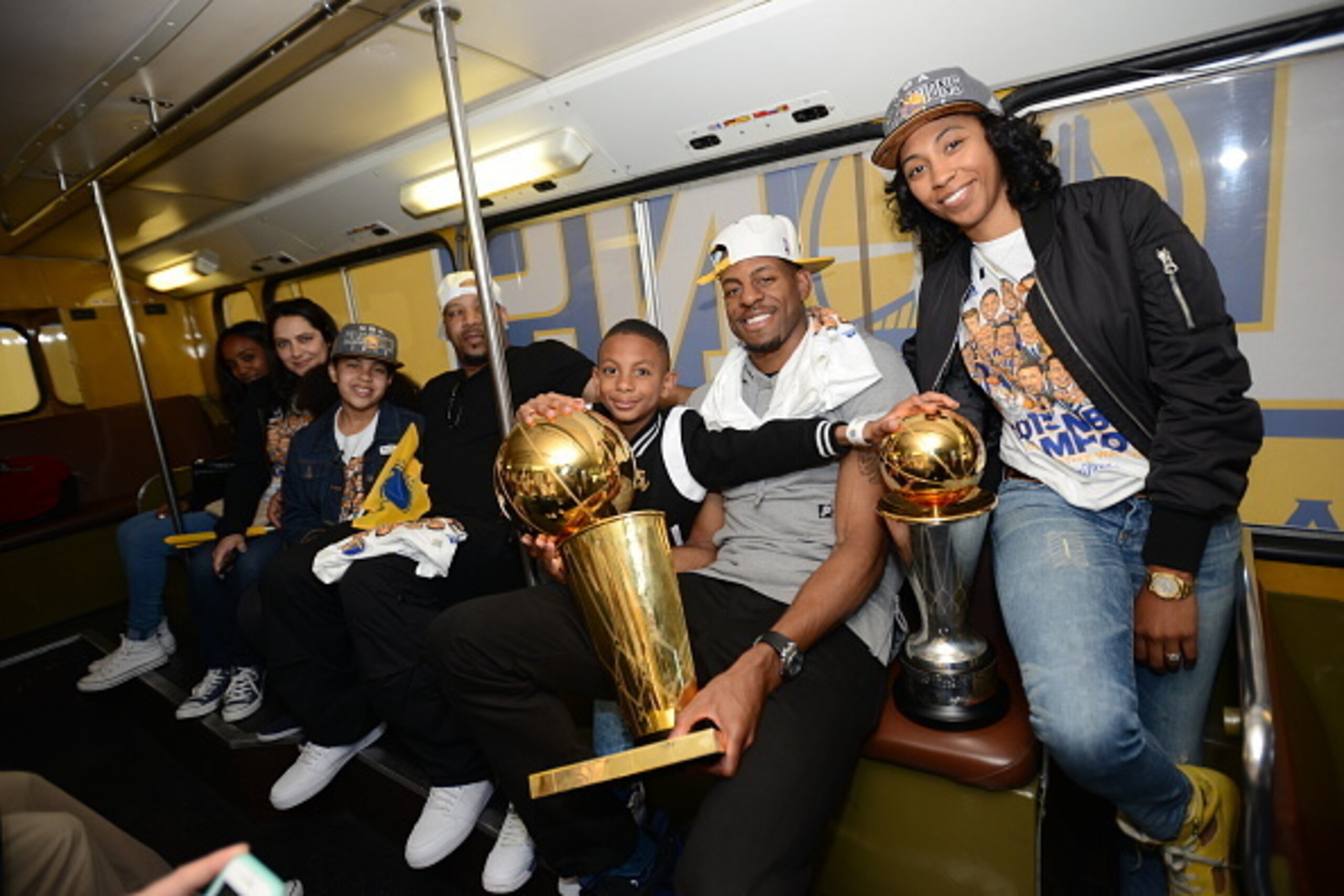 OAKLAND, CA - JUNE 19: Andre Iguodala #9 of the Golden State Warriors celebrates winning the Bill Russell Finals MVP award and the 2015 NBA Championship with his family during a parade on June 19, 2015 in Oakland, CA.  NOTE TO USER: User expressly acknowl