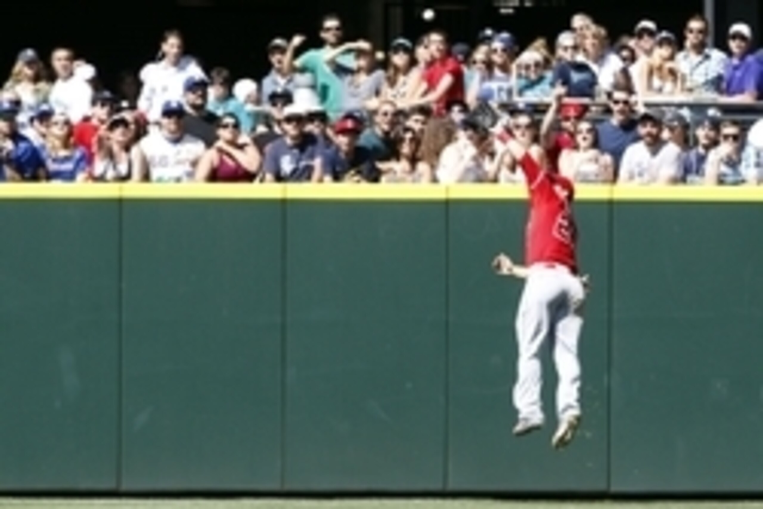 Jul 12, 2015; Seattle, WA, USA; Los Angeles Angels center fielder Mike Trout (27) jumps to catch a line drive against the Seattle Mariners during the eighth inning at Safeco Field. Mandatory Credit: Jennifer Buchanan-USA TODAY Sports