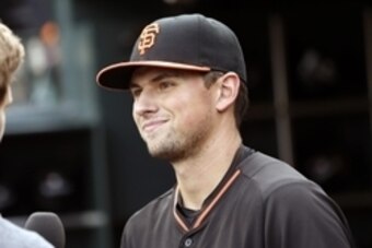 May 20, 2015; San Francisco, CA, USA; San Francisco Giants second baseman Joe Panik (12) talks with a fan before the game between the San Francisco Giants and the Los Angeles Dodgers at AT&T Park. Mandatory Credit: Bob Stanton-USA TODAY Sports