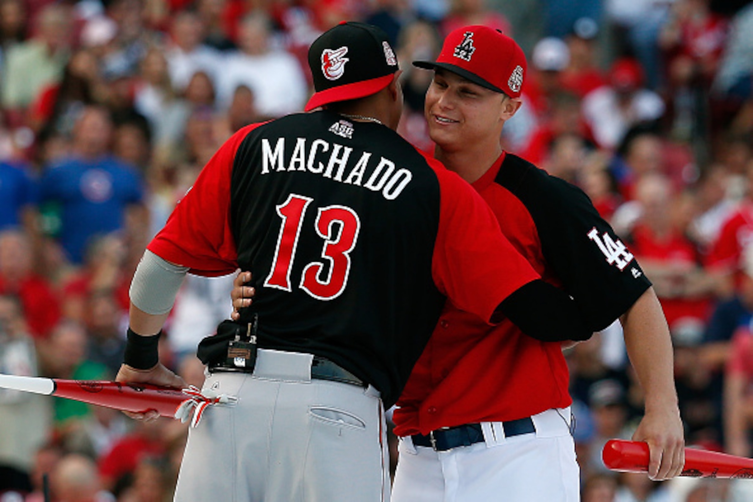 CINCINNATI, OH - JULY 13:  American League All-Star Manny Machado #13 of the Baltimore Orioles hugs National League All-Star Joc Pederson #31 Los Angeles Dodgers during the Gillette Home Run Derby presented by Head & Shoulders at the Great American Ball P
