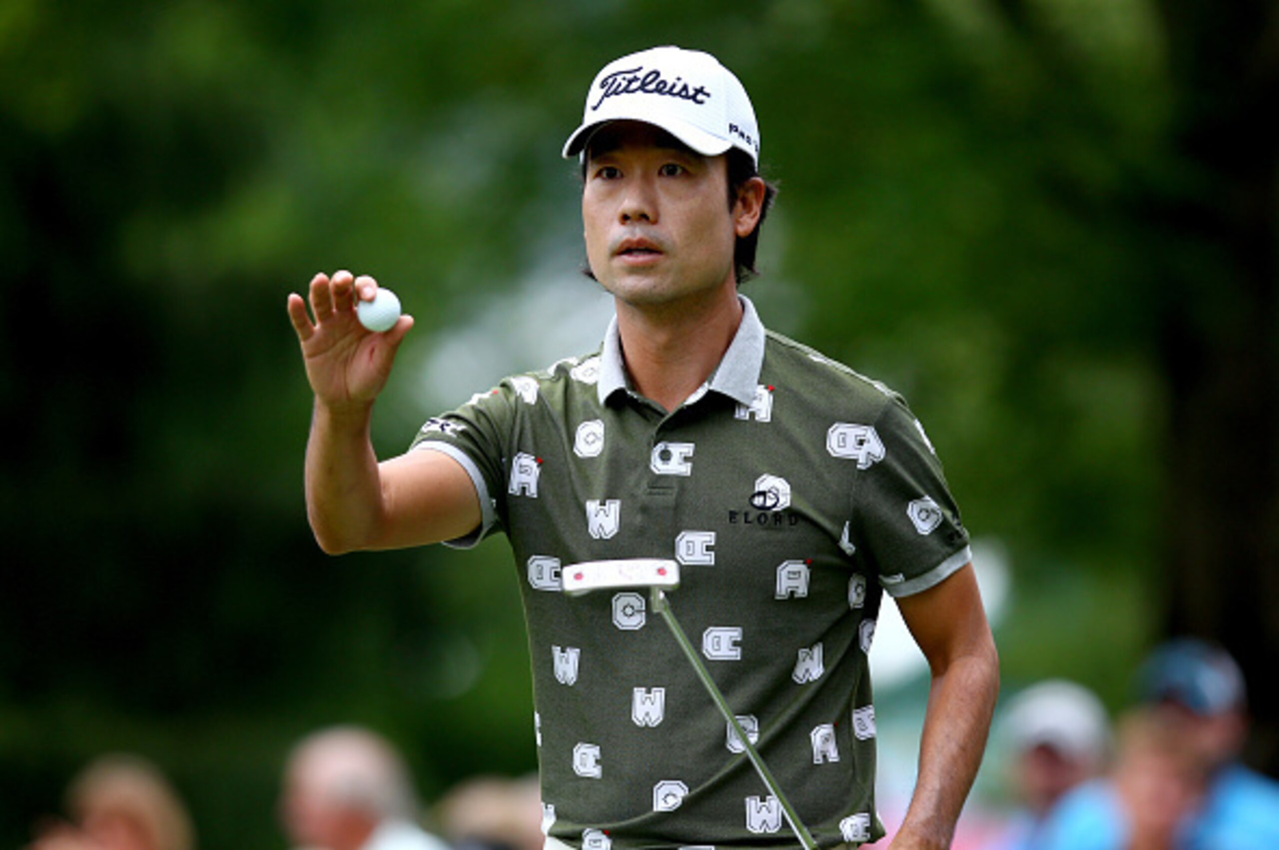 WHITE SULPHUR SPRINGS, WV - JULY 05:  Kevin Na picks up his ball after making his putt on the 11th green during the final round of the Greenbrier Classic held at The Old White TPC on July 5, 2015 in White Sulphur Springs, West Virginia.  (Photo by Mariann