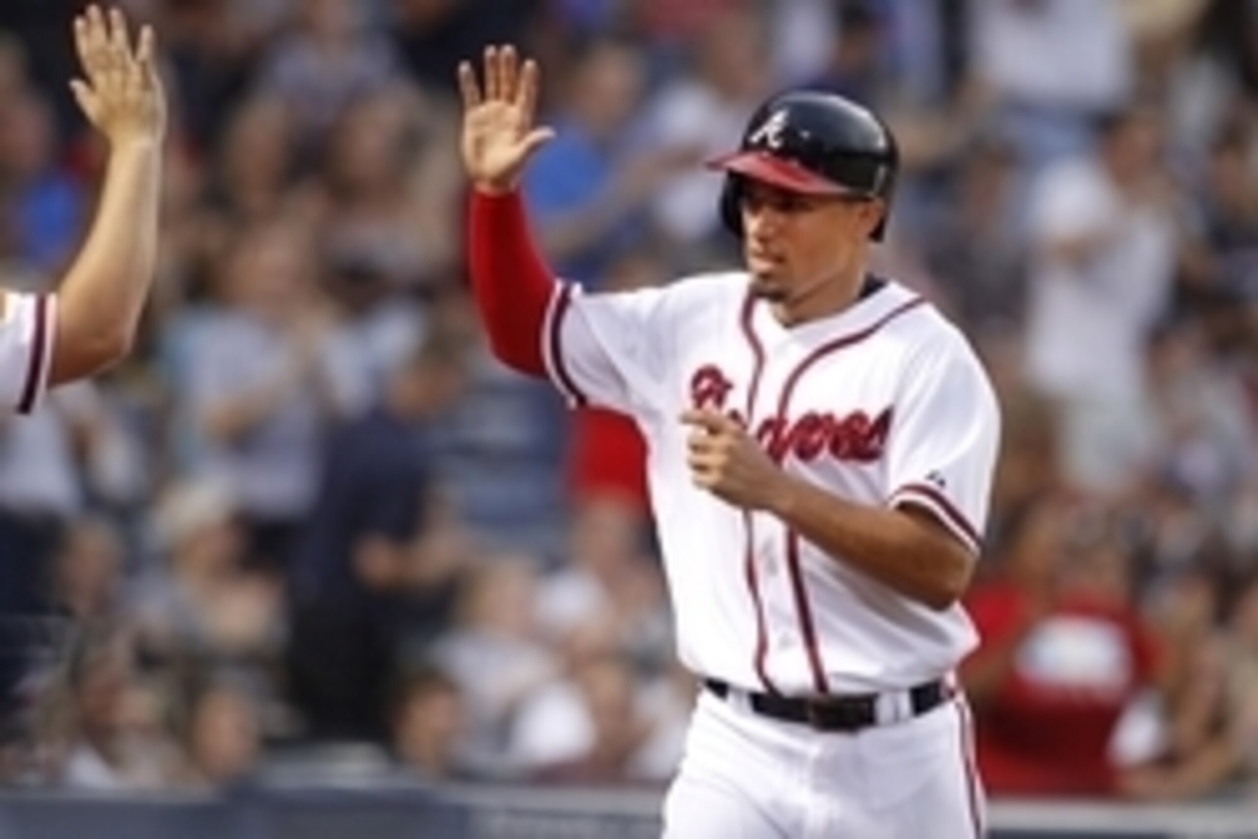 Jul 4, 2015; Atlanta, GA, USA; Atlanta Braves second baseman Jace Peterson (8) celebrates with teammates after scoring a run against the Philadelphia Phillies in the fourth inning at Turner Field. Mandatory Credit: Brett Davis-USA TODAY Sports