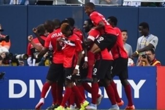 Jul 9, 2015; Chicago, IL, USA; The Trinidad & Tobago players celebrate after a goal in the first half during CONCACAF Gold Cup group play at Soldier Field. Mandatory Credit: Mike DiNovo-USA TODAY Sports