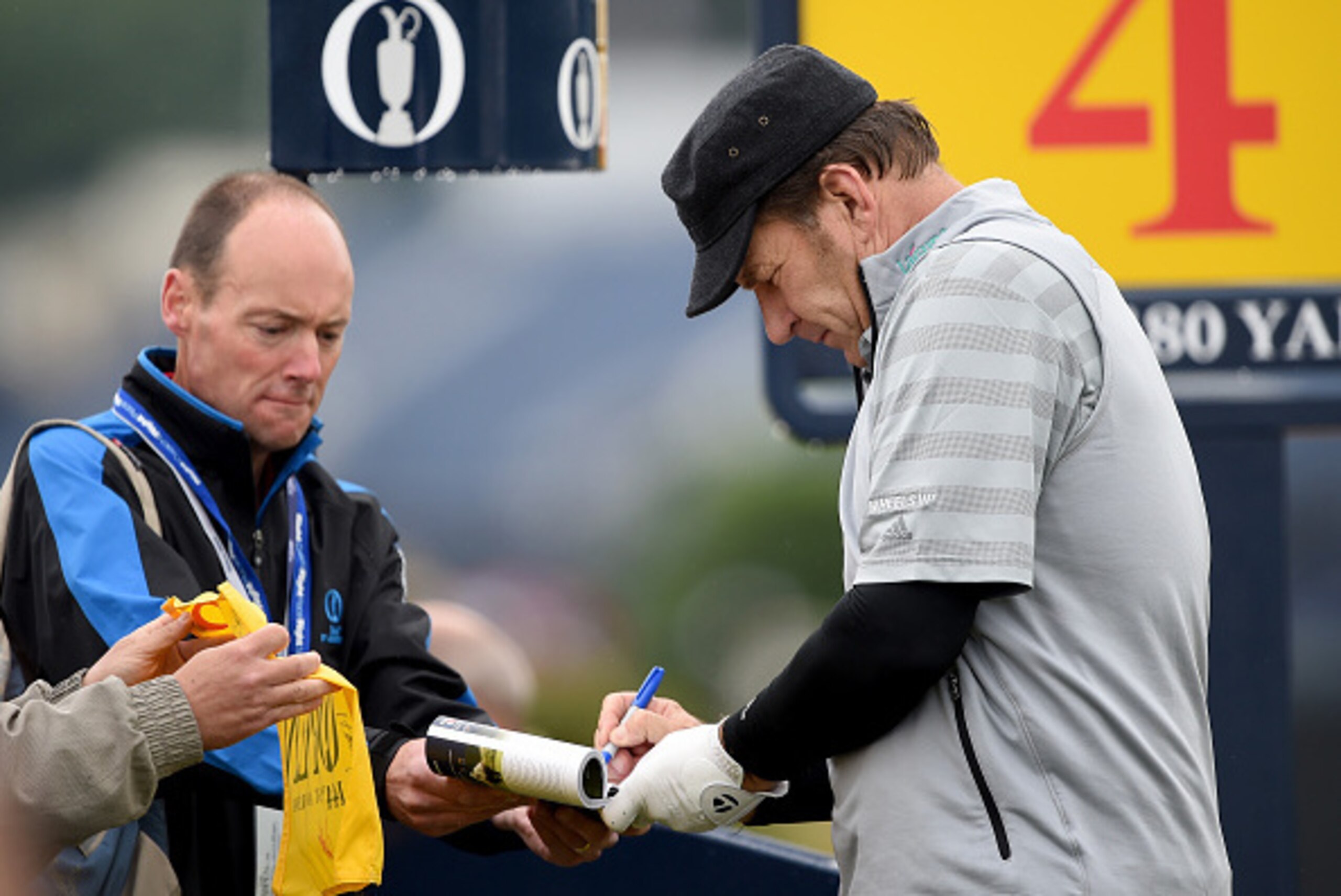 ST ANDREWS, SCOTLAND - JULY 13:  Sir Nick Faldo signs an autograph as he plays a practice round ahead of the 144th Open Championship at The Old Course on July 13, 2015 in St Andrews, Scotland.  (Photo by Stuart Franklin/Getty Images)