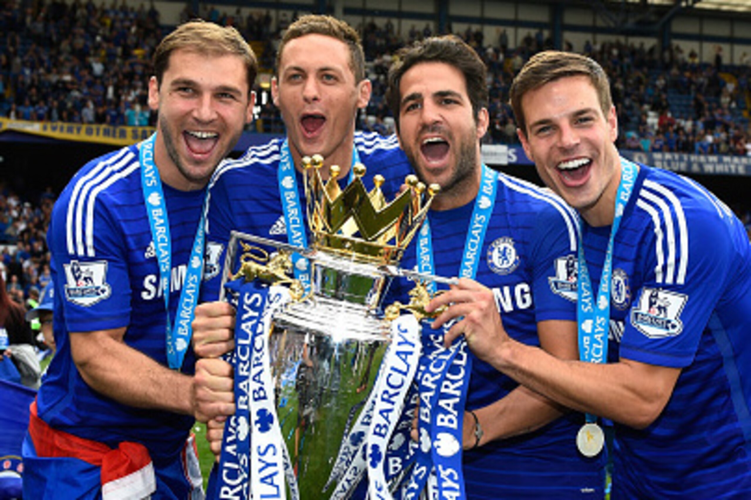 LONDON, ENGLAND - MAY 24:  (L-R) Branislav Ivanovic, Nemanja Matic, Cesc Fabregas and Cesar Azpilicueta of Chelsea celebrate with the trophy after the Barclays Premier League match between Chelsea and Sunderland at Stamford Bridge on May 24, 2015 in Londo