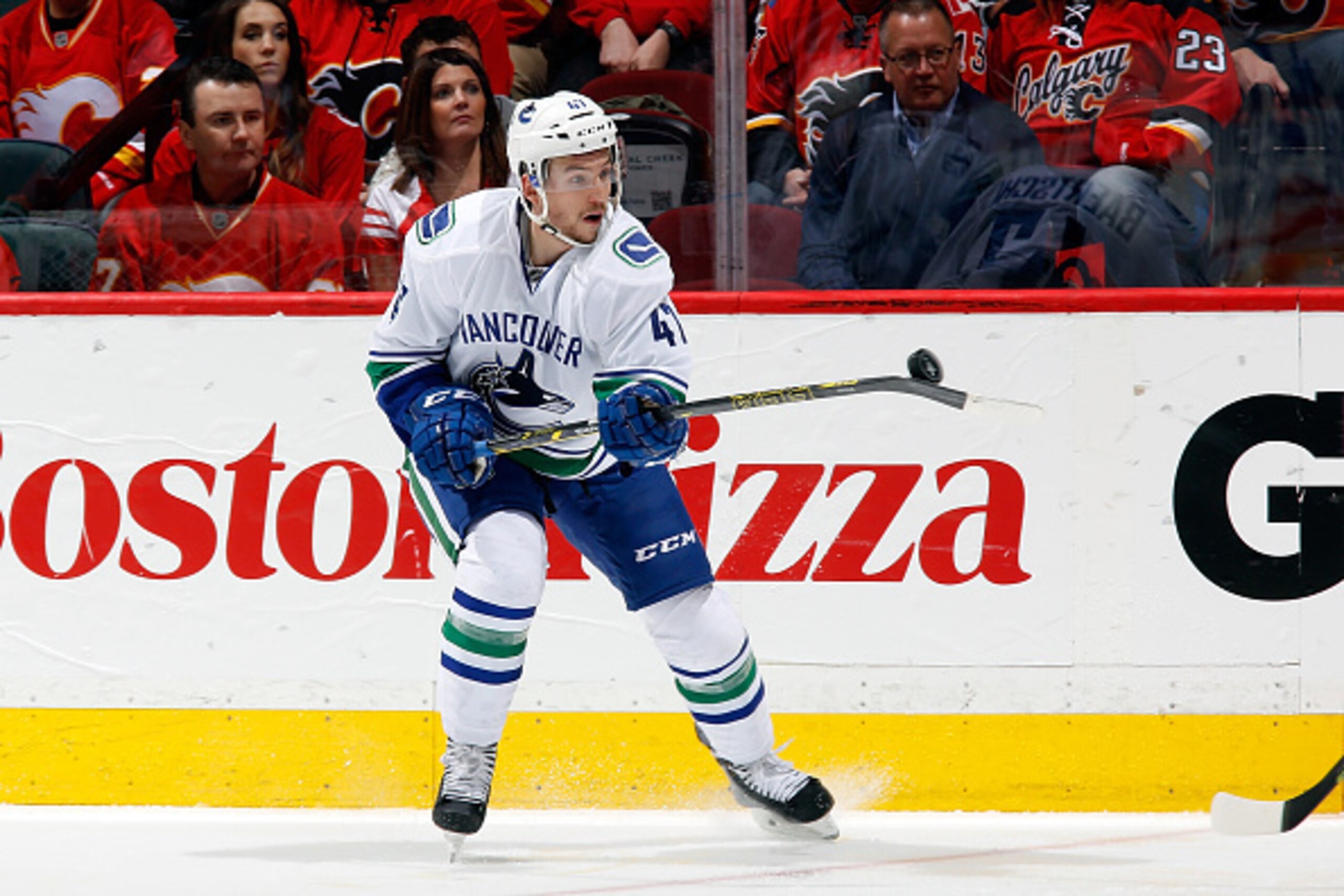 CALGARY, AB - APRIL 25: Sven Baertschi #47 the Vancouver Canucks gains control of the puck in mid-air during the game against the Calgary Flames at Scotiabank Saddledome for Game Six of the Western Quarterfinals during the 2015 NHL Stanley Cup Playoffs on