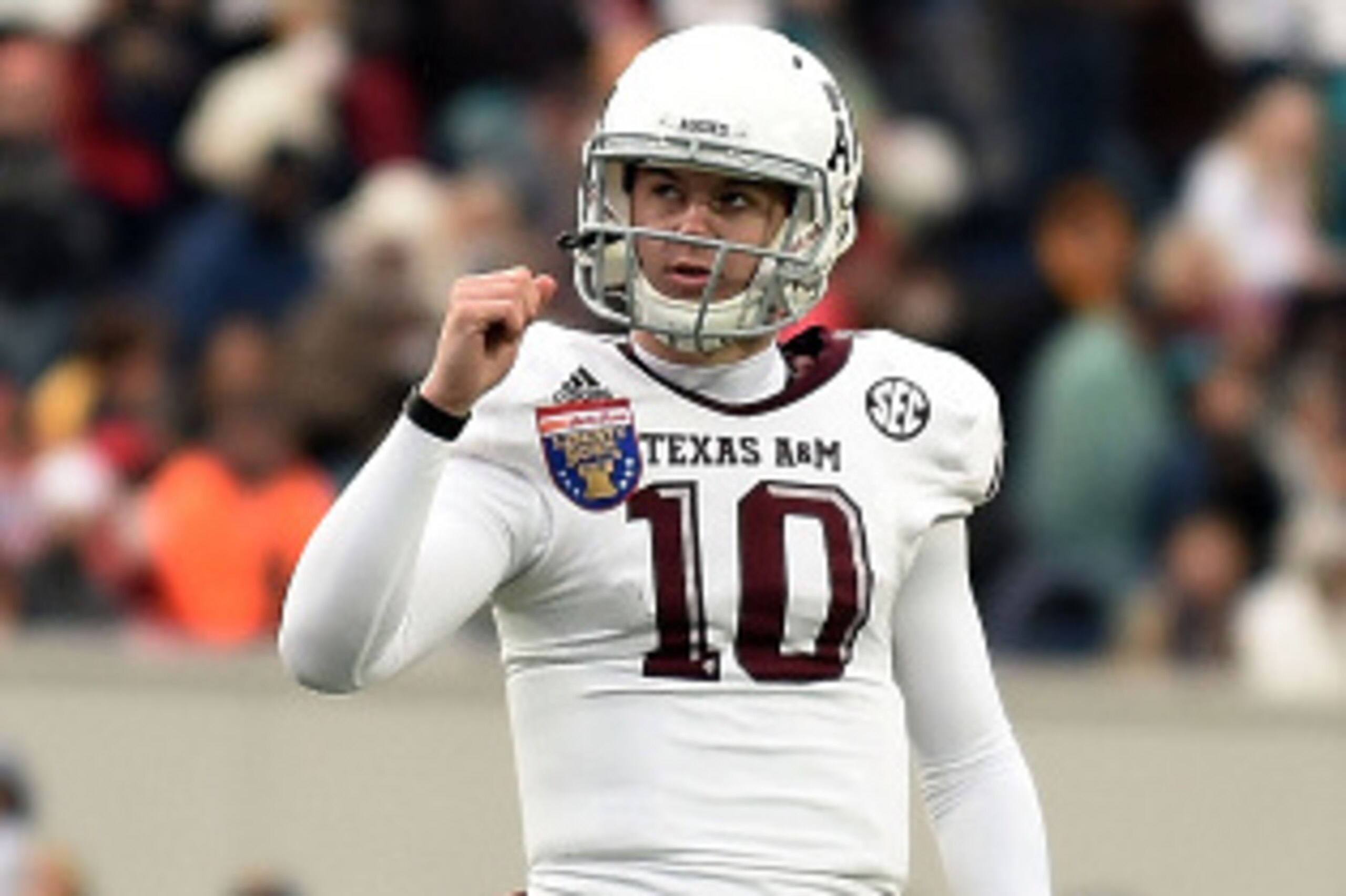 MEMPHIS, TN - DECEMBER 29:  Kyle Allen #10 of the Texas A&M Aggies reacts to a touchdown against the West Virginia Mountaineers during the third quarter of the 56th annual Autozone Liberty Bowl at Liberty Bowl Memorial Stadium on December 29, 2014 in Memp