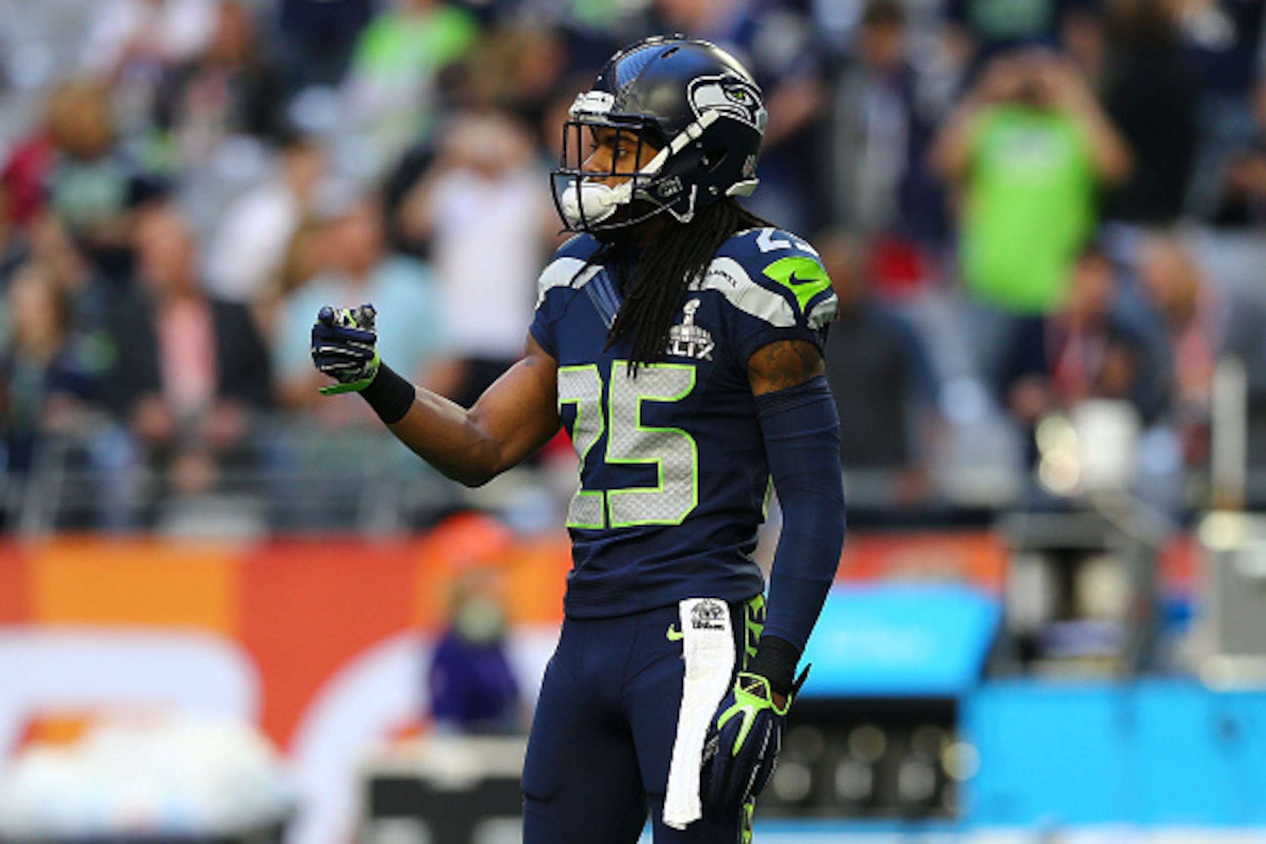 GLENDALE, AZ - FEBRUARY 01:  Richard Sherman #25 of the Seattle Seahawks gestures during Super Bowl XLIX against the New England Patriots at University of Phoenix Stadium on February 1, 2015 in Glendale, Arizona.  (Photo by Elsa/Getty Images)