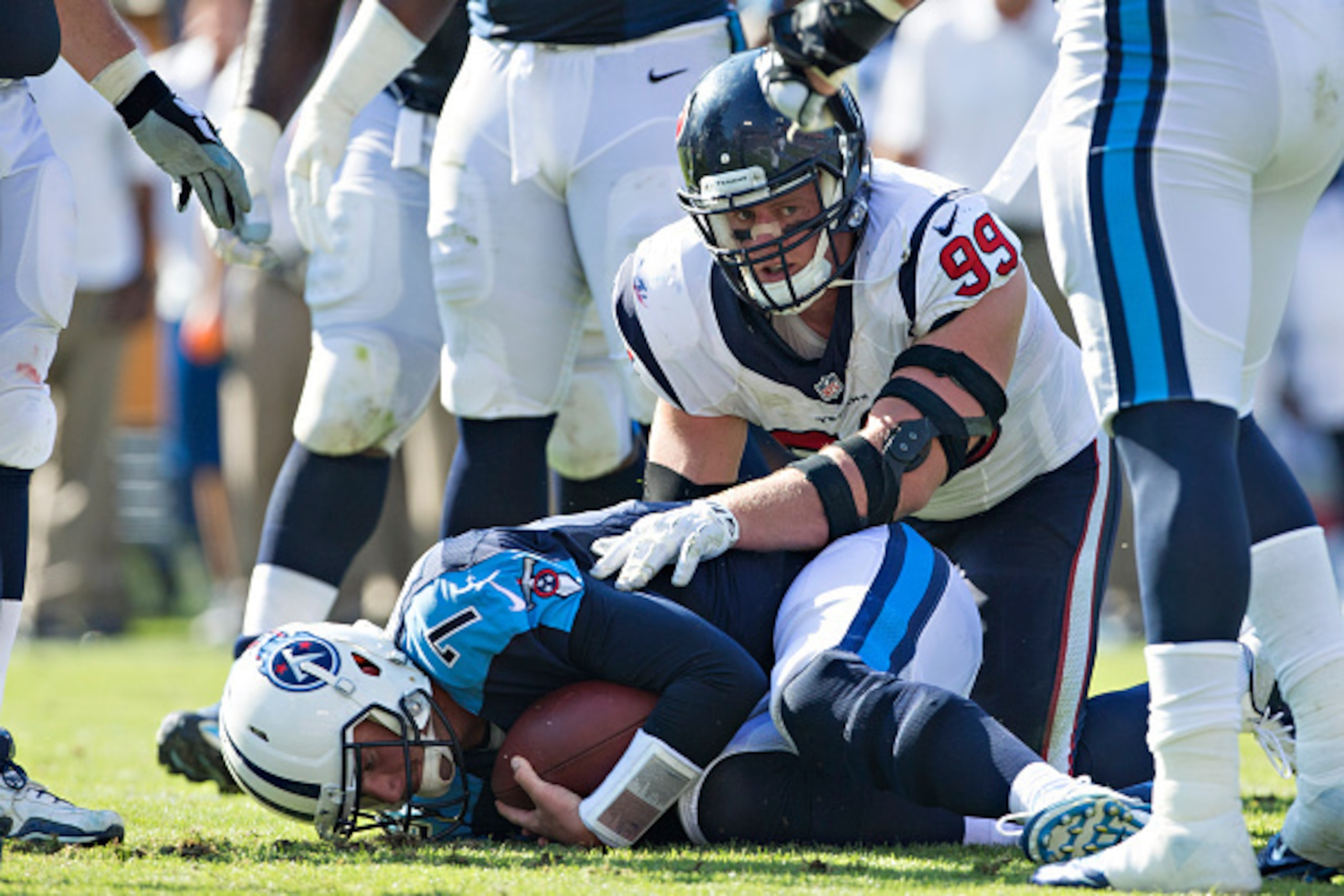 NASHVILLE, TN - OCTOBER 26:  J.J. Watt #99 of the Houston Texans sacks Zach Mettenberger #7 of the Tennessee Titans at LP Field on October 26, 2014 in Nashville, Tennessee.  The Texans defeated the Titans 30-16.  (Photo by Wesley Hitt/Getty Images)