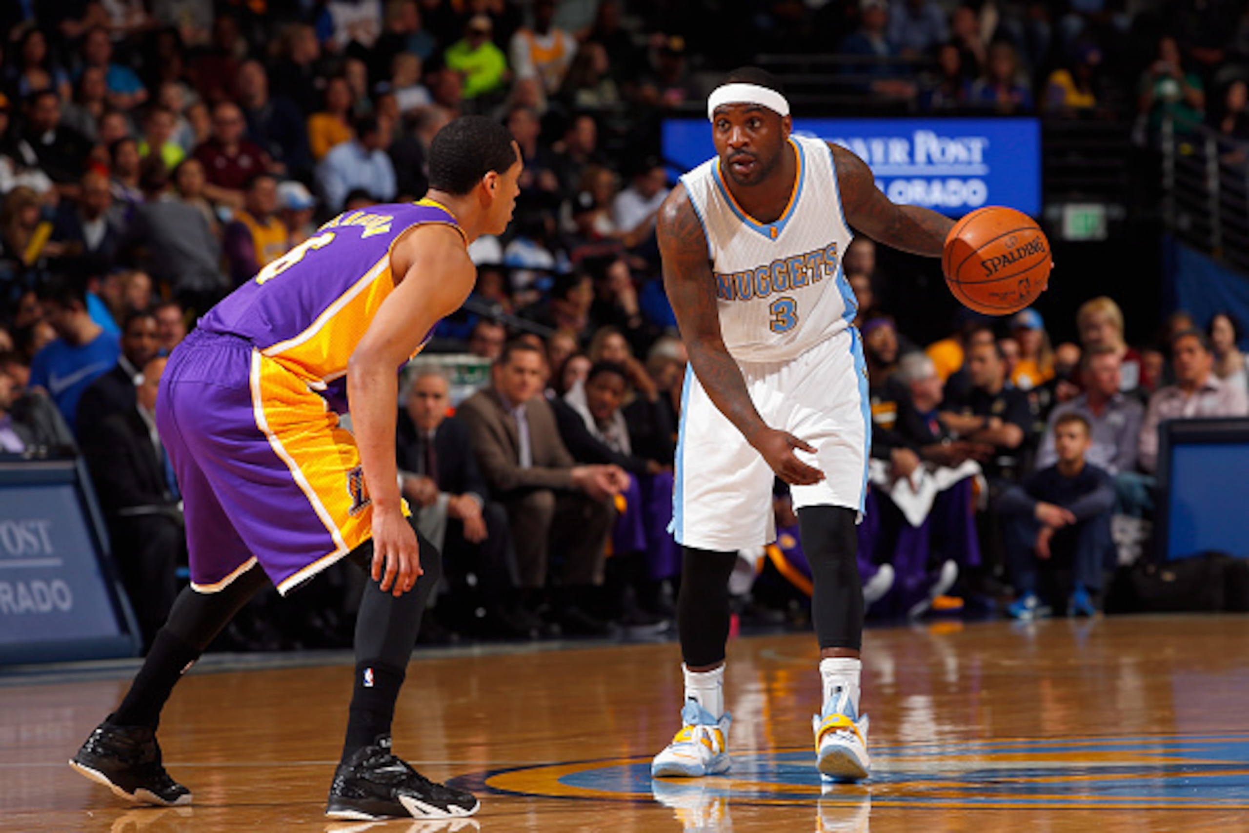 DENVER, CO - APRIL 08:  Ty Lawson #3 of the Denver Nuggets controls the ball against Jordan Clarkson #6 of the Los Angeles Lakers at Pepsi Center on April 8, 2015 in Denver, Colorado. The Nuggets defeated the Lakers 119-101. NOTE TO USER: User expressly a