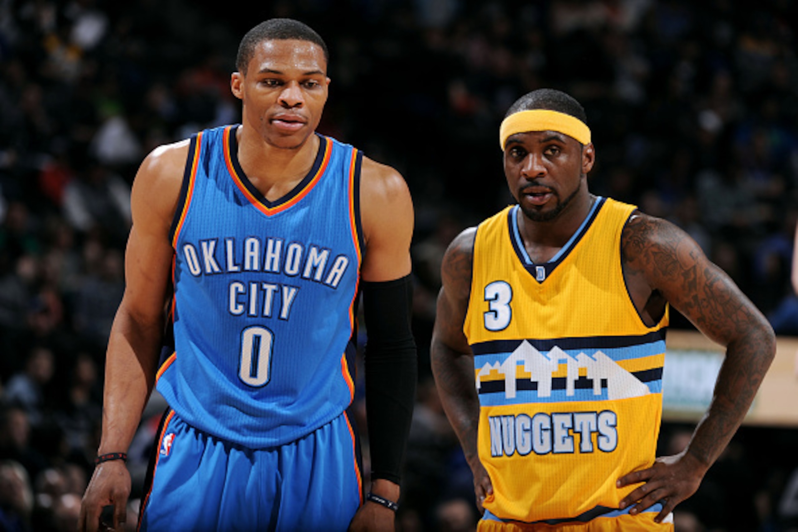 DENVER, CO - FEBRUARY 9: Russell Westbrook #0 of the Oklahoma City Thunder and Ty Lawson #3 of the Denver Nuggets stand on the court during a game on February 9, 2015 at Pepsi Center in Denver, Colorado. NOTE TO USER: User expressly acknowledges and agree