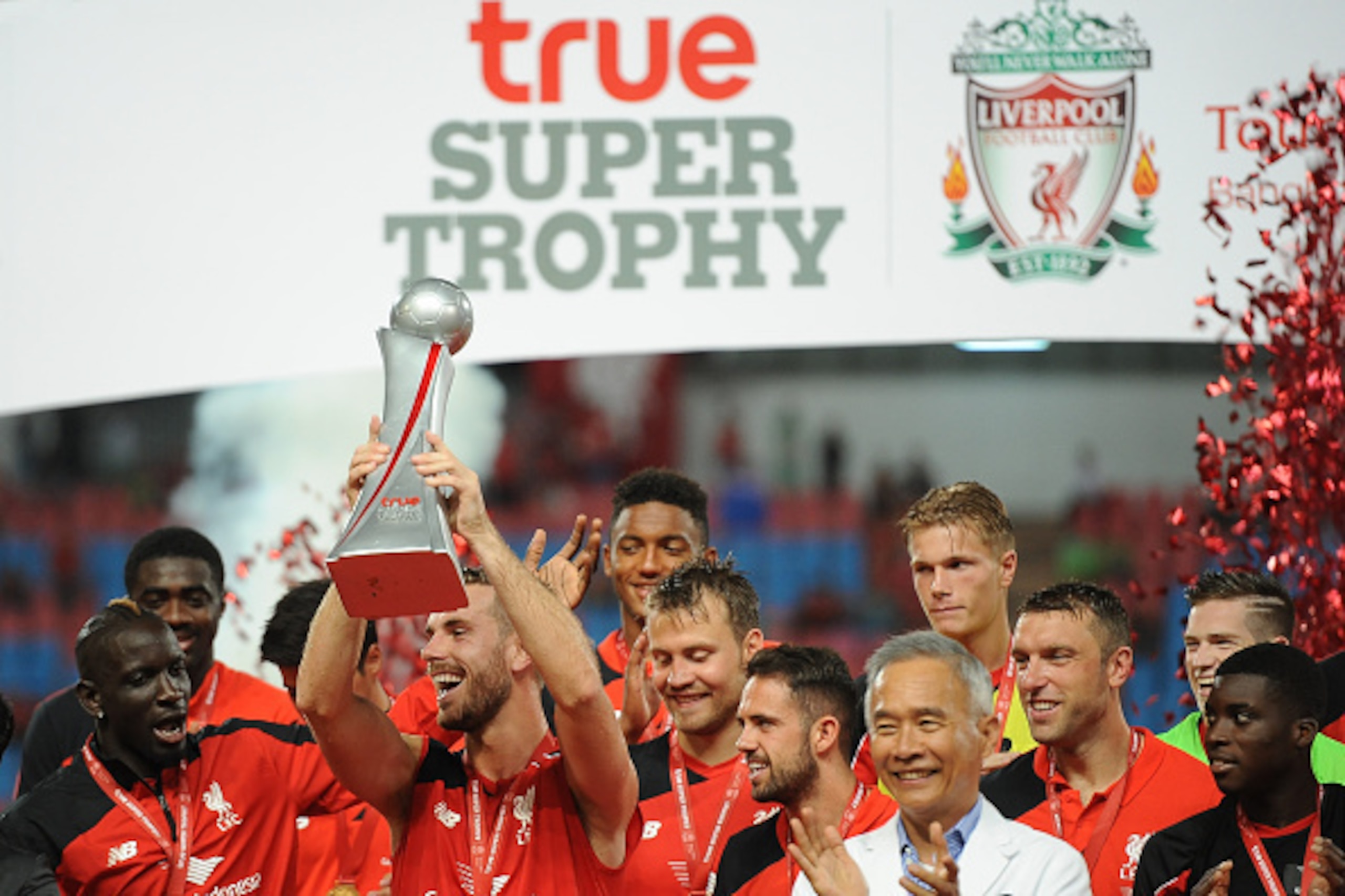BANGKOK, THAILAND - JULY 14: Liverpool FC team celebrate with the true Super Trophy replica after the international friendly match between Thai Premier League All Stars and Liverpool FC at Rajamangala Stadium on July 14, 2015 in Bangkok, Thailand. (Phot BANGKOK, THAILAND - JULY 14: Liverpool FC team celebrate with the true Super Trophy replica after the international friendly match between Thai Premier League All Stars and Liverpool FC at Rajamangala Stadium on July 14, 2015 in Bangkok, Thailand. (Phot