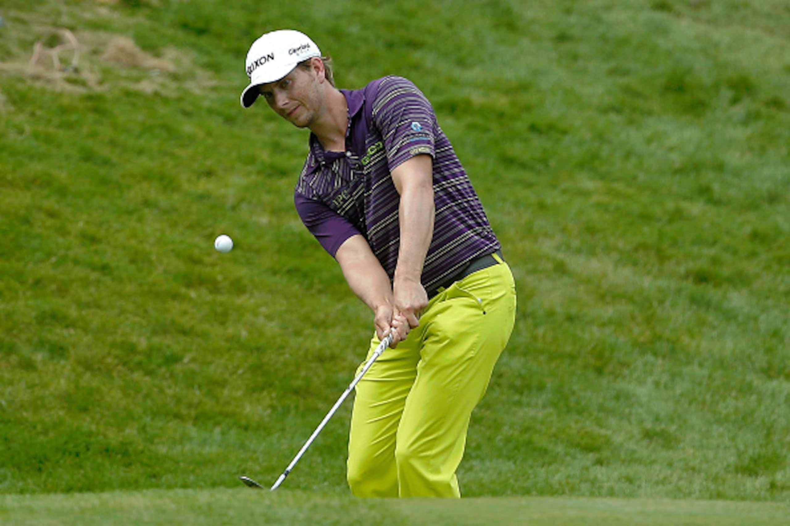 SILVIS, IL - JULY 12: Chris Stroud takes a shot outisde the 18th green during the final round of the John Deere Classic held at TPC Deere Run on July 12, 2015 in Silvis, Illinois.  (Photo by Jon Durr/Getty Images)