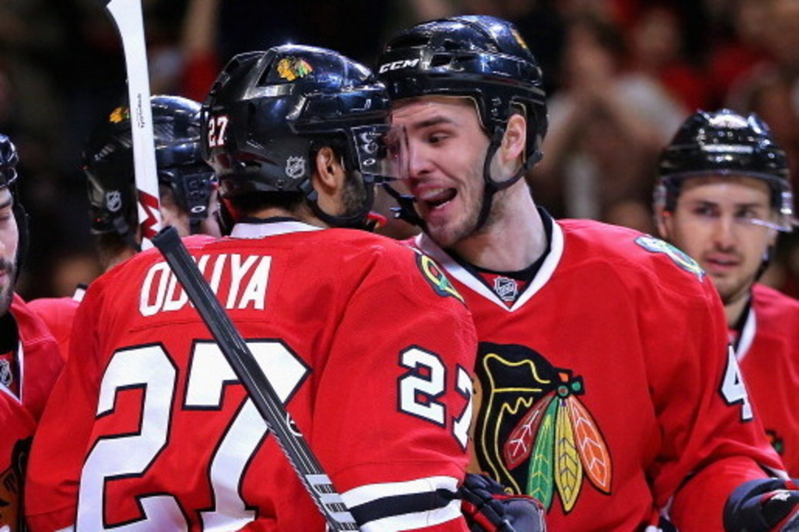 CHICAGO, IL - JANUARY 12: Niklas Hjalmarsson #4 and Johnny Oduya #27 of the Chicago Blackhawks celebrate a goal against Edmonton Oilers at the United Center on January 12, 2014 in Chicago, Illinois. The Blackhawks defeated the Oilers 5-3. (Photo by Jon CHICAGO, IL - JANUARY 12: Niklas Hjalmarsson #4 and Johnny Oduya #27 of the Chicago Blackhawks celebrate a goal against Edmonton Oilers at the United Center on January 12, 2014 in Chicago, Illinois. The Blackhawks defeated the Oilers 5-3. (Photo by Jon