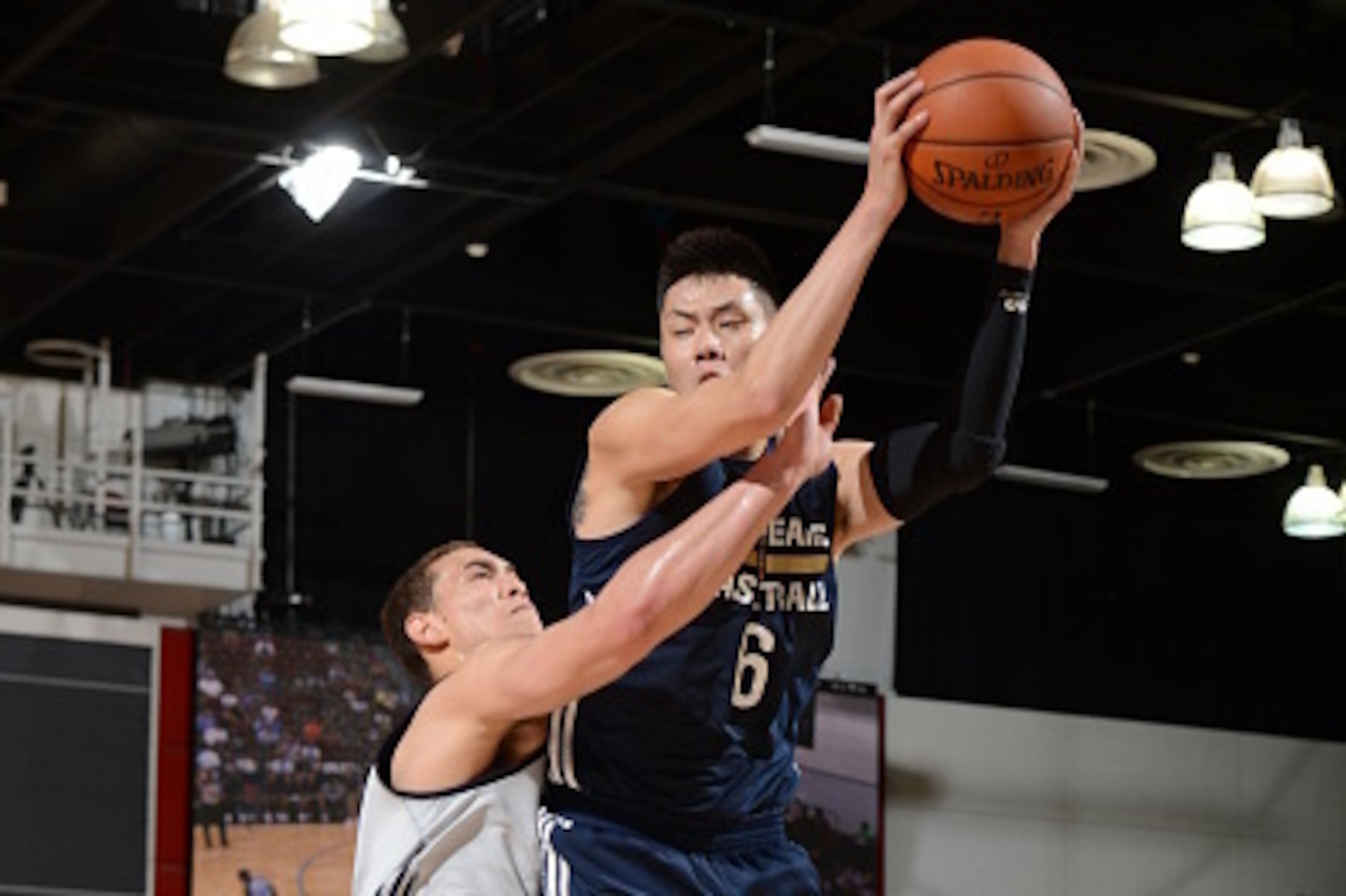 LAS VEGAS, NV - JULY 11: He Tianju #6 of the New Orleans Pelicans grabs the rebound against the Dallas Mavericks on July 11, 2015 at the Cox Pavilion in Las Vegas, Nevada.  NOTE TO USER: User expressly acknowledges and agrees that, by downloading and or u