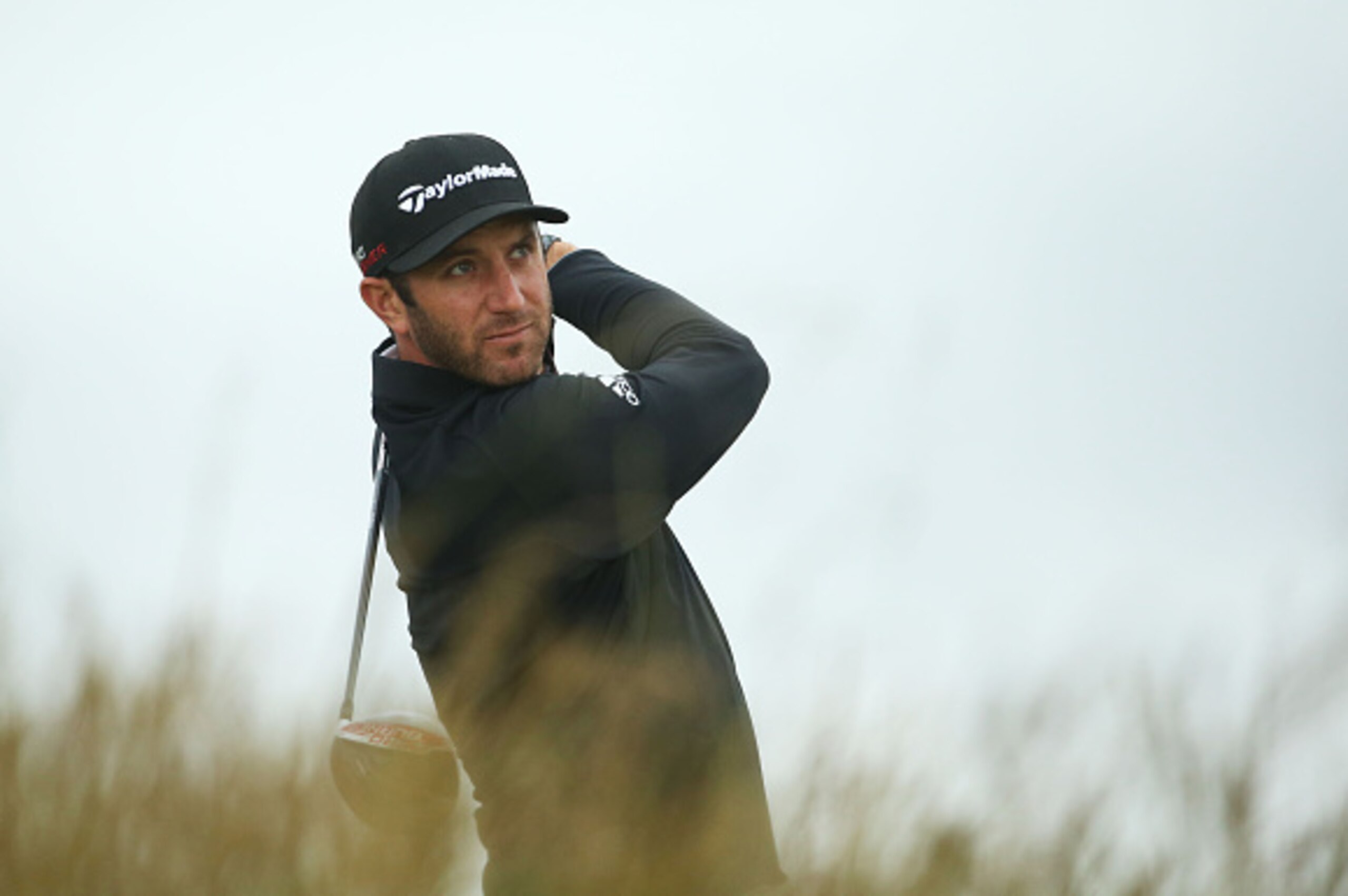 ST ANDREWS, SCOTLAND - JULY 14:  Dustin Johnson of the United States plays a shot during a practice round ahead of the 144th Open Championship at The Old Course on July 14, 2015 in St Andrews, Scotland.  (Photo by Streeter Lecka/Getty Images)