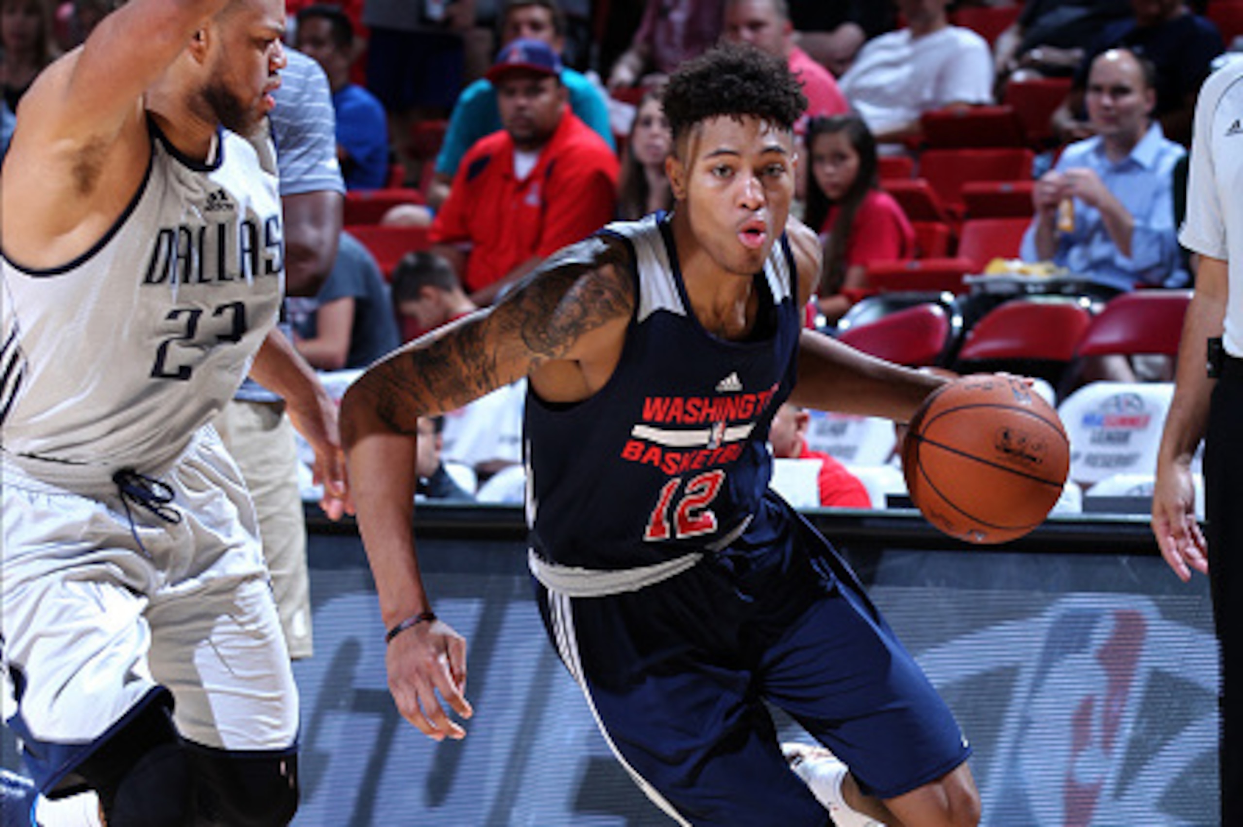 LAS VEGAS, NV - JULY 14: Kelly Oubre Jr. #12 of the Washington Wizards drives to the basket against the Dallas Mavericks on July 14, 2015 at the Thomas & Mack Center in Las Vegas, Nevada. NOTE TO USER: User expressly acknowledges and agrees that, by down LAS VEGAS, NV - JULY 14: Kelly Oubre Jr. #12 of the Washington Wizards drives to the basket against the Dallas Mavericks on July 14, 2015 at the Thomas & Mack Center in Las Vegas, Nevada. NOTE TO USER: User expressly acknowledges and agrees that, by down