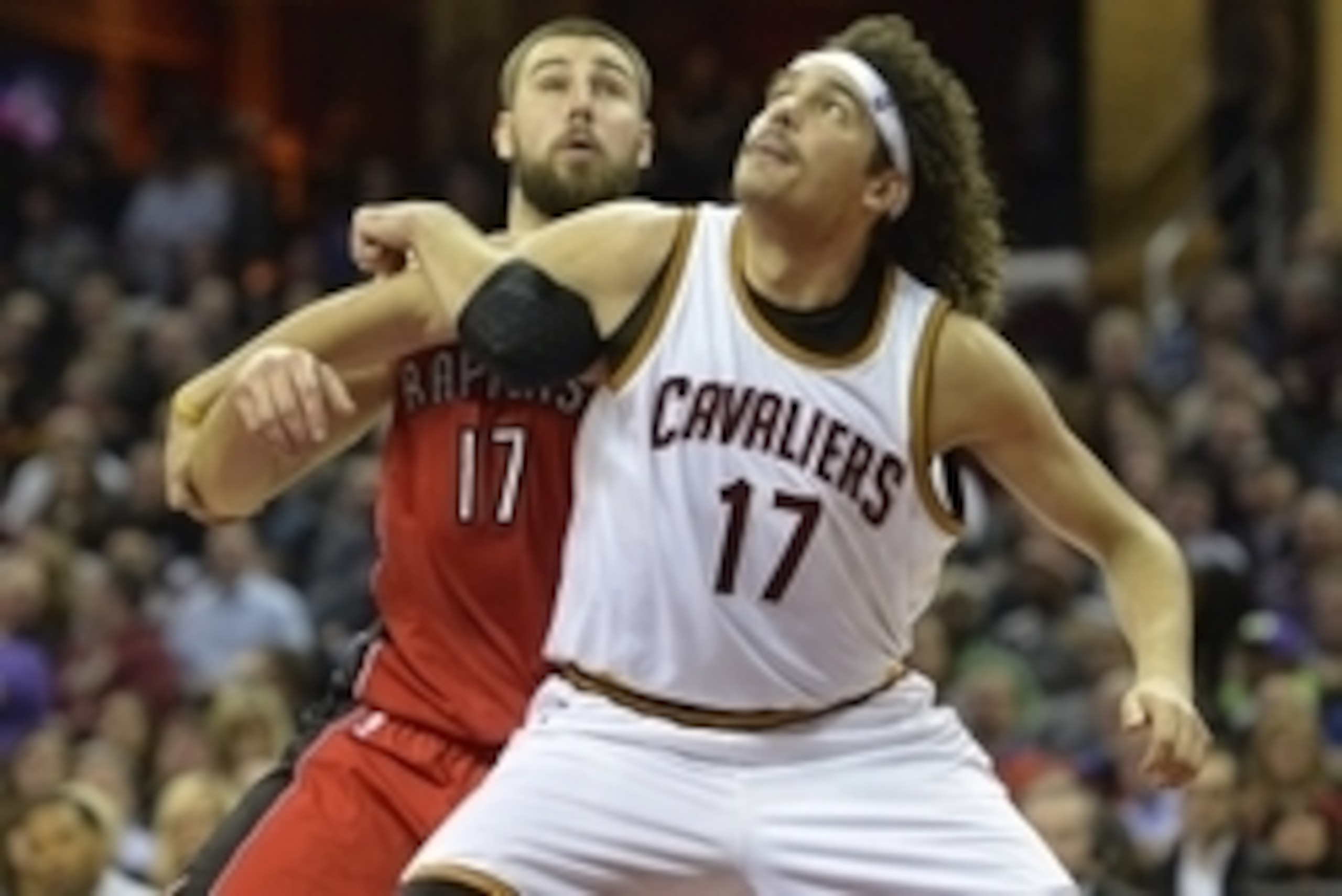 Dec 9, 2014; Cleveland, OH, USA; Toronto Raptors center Jonas Valanciunas (17) and Cleveland Cavaliers center Anderson Varejao (17) position for a rebound in the second quarter at Quicken Loans Arena. Mandatory Credit: David Richard-USA TODAY Sports
