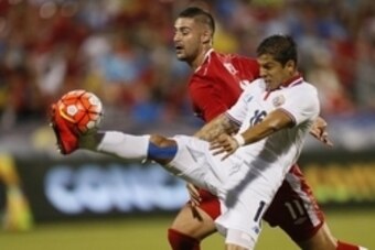 Jul 14, 2015; Toronto, ON, USA; Costa Rica defender Christian Gamboa (16) kicks the ball as Canada forward Marcus Haber (11) defends during CONCACAF Gold Cup group play at BMO Field. Mandatory Credit: John E. Sokolowski-USA TODAY Sports