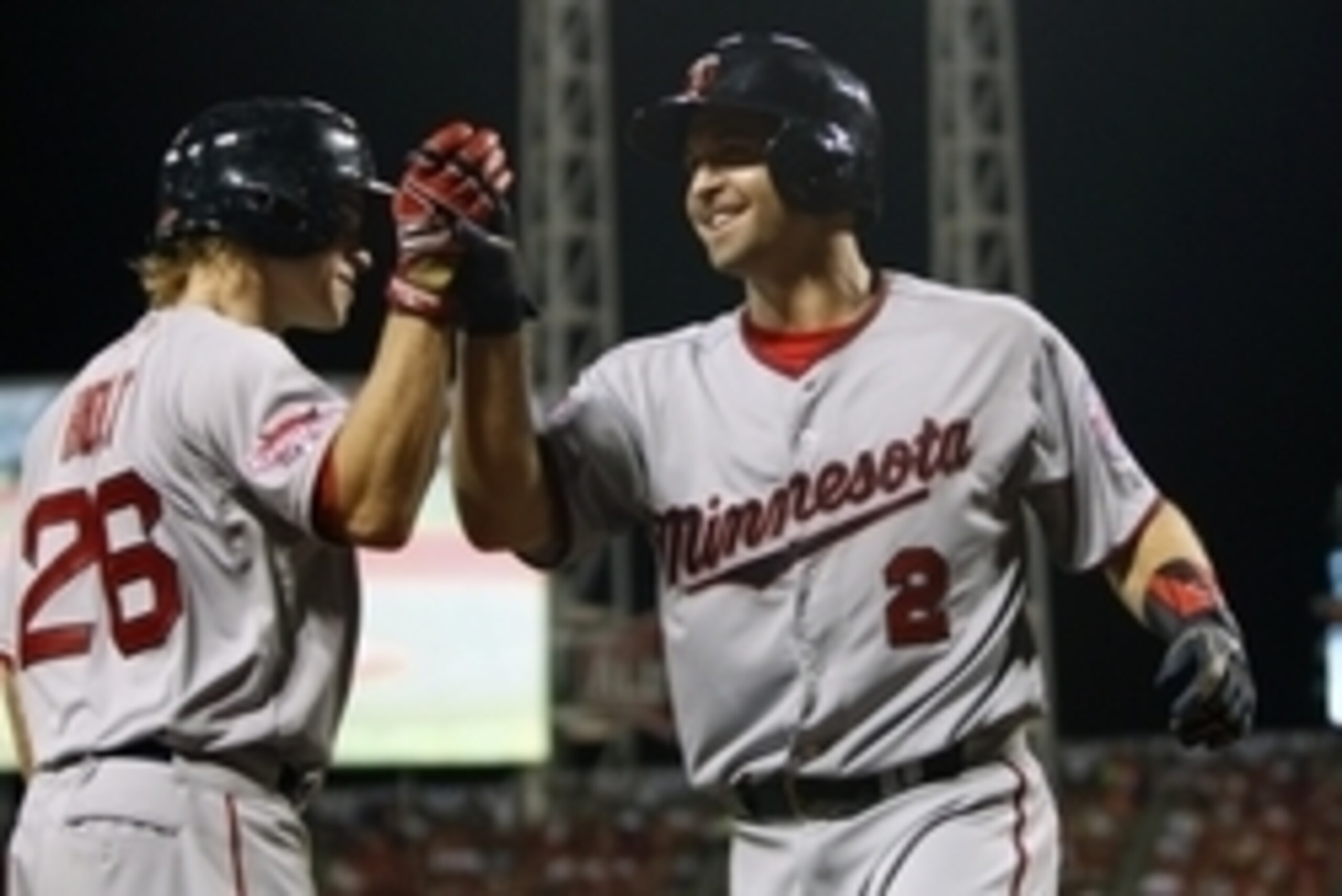 Jul 14, 2015; Cincinnati, OH, USA; American League second baseman Brian Dozier (2) of the Minnesota Twins celebrates with American League third baseman Brock Holt (26) of the Boston Red Sox after hitting a solo home run against the National League during 