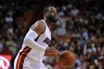 Apr 11, 2015; Miami, FL, USA; Miami Heat guard Dwyane Wade (3) dribbles the ball against the Toronto Raptors during the second half at American Airlines Arena. Mandatory Credit: Steve Mitchell-USA TODAY Sports