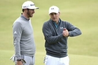 Jul 16, 2015; St. Andrews, Fife, SCT; Dustin Johnson, (left ) and Jordan Spieth chat on the 18th after their first round in the 144th Open Championship at St. Andrews - Old Course. Mandatory Credit: Ian Rutherford-USA TODAY Sports