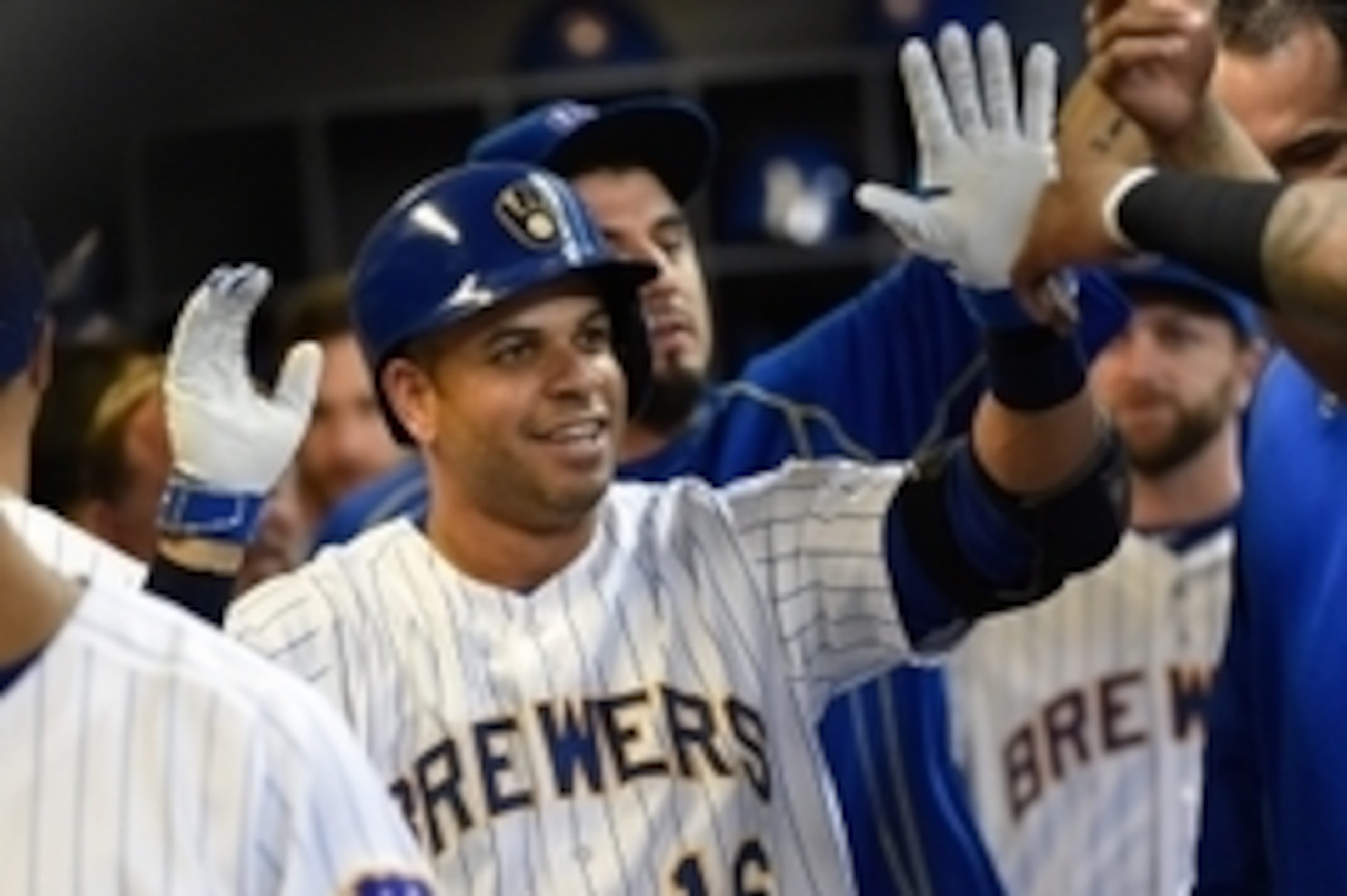 Jun 26, 2015; Milwaukee, WI, USA; Milwaukee Brewers third baseman Aramis Ramirez (16) is greeted in the dugout after hitting a 2-run homer in the second inning against the Minnesota Twins at Miller Park. Mandatory Credit: Benny Sieu-USA TODAY Sports