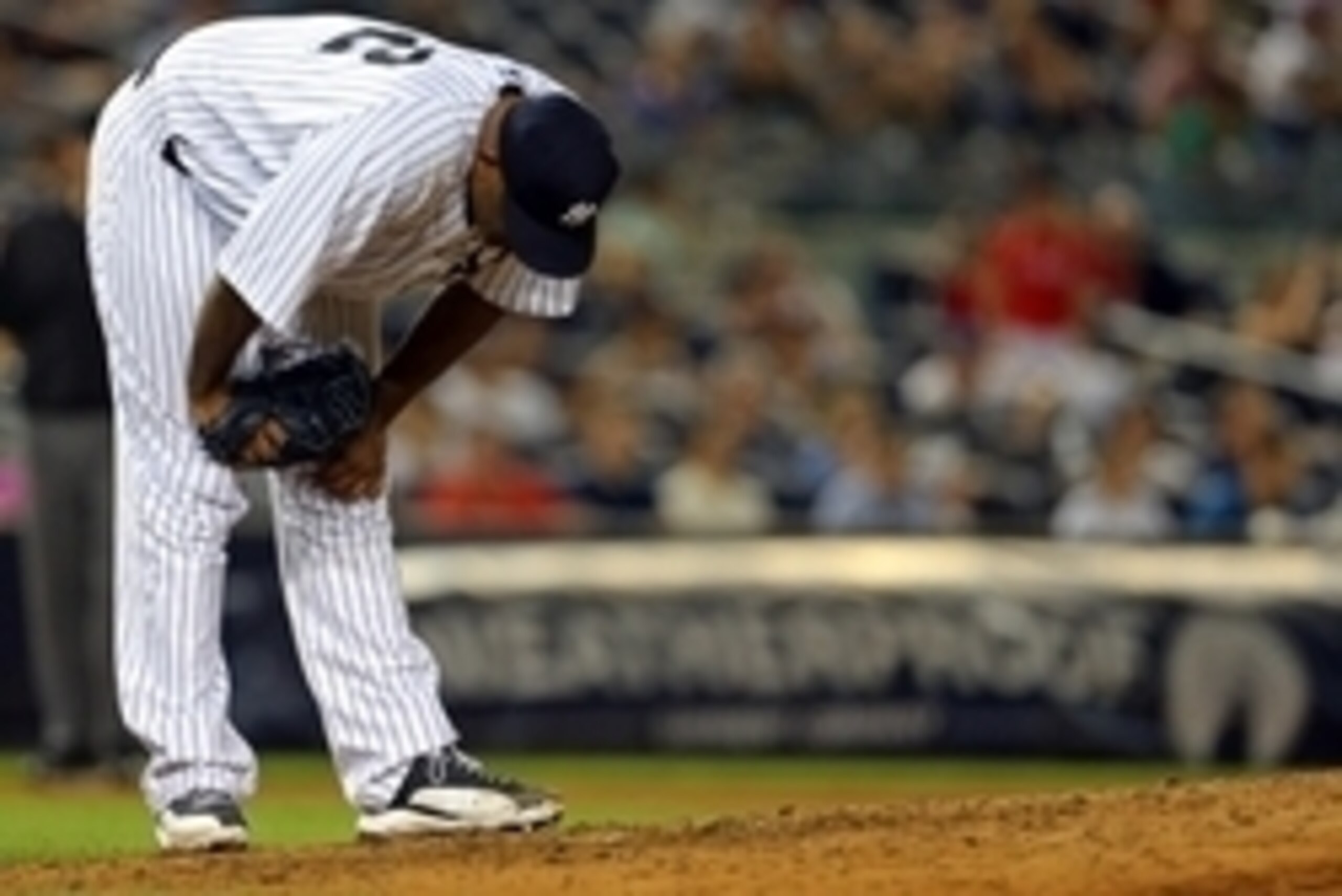 Jun 23, 2015; Bronx, NY, USA; New York Yankees starting pitcher CC Sabathia (52) reacts after giving up a three-run home run by Philadelphia Phillies third baseman Maikel Franco (7) during the fourth inning of an inter-league baseball game at Yankee Stadi