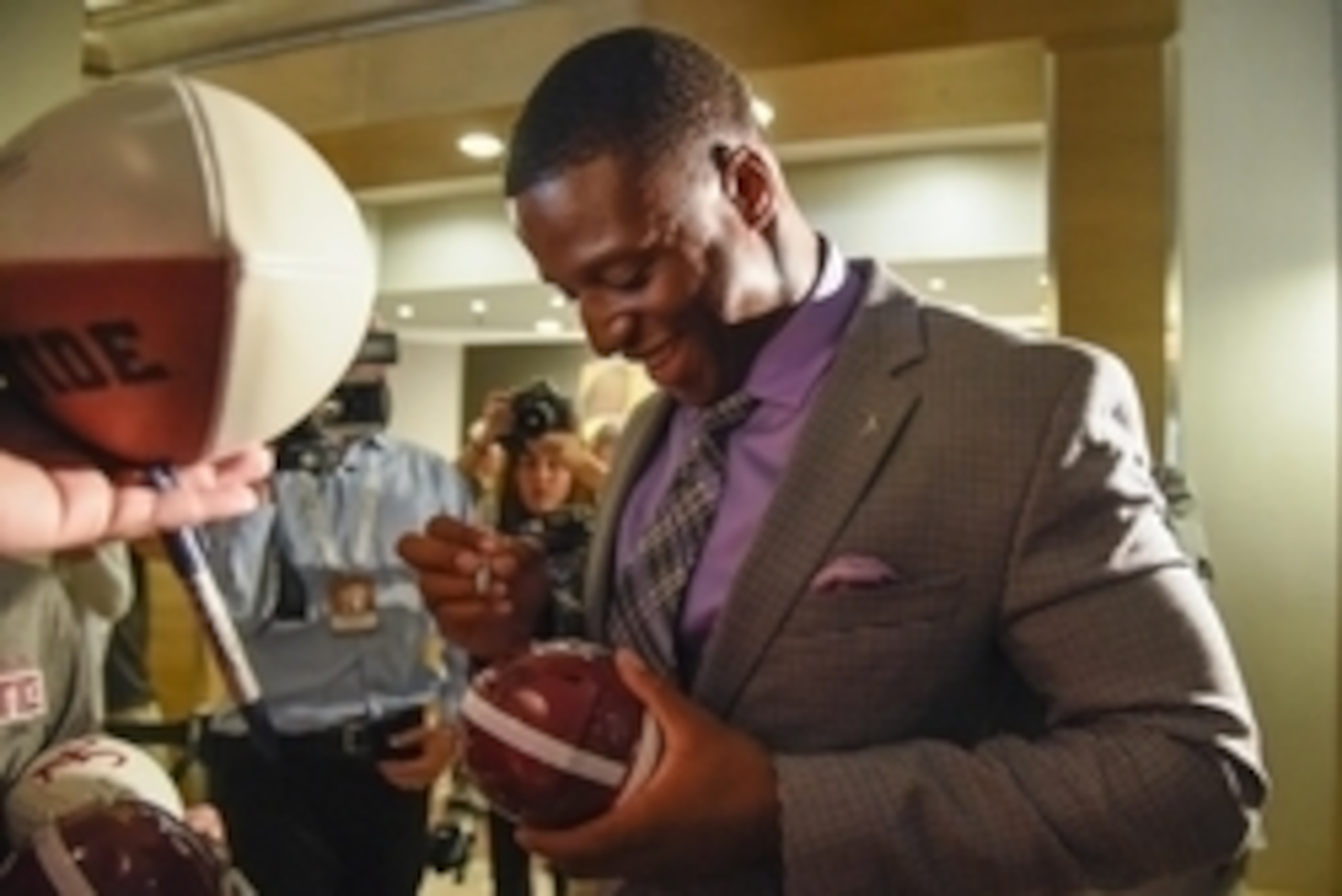 Jul 15, 2015; Birmingham, AL, USA;  Alabama Crimson Tide running back Kenyan Drake signs autographs for fans during SEC media day at the Wynfrey Hotel. Mandatory Credit: Shanna Lockwood-USA TODAY Sports