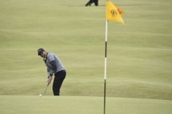 Jul 16, 2015; St. Andrews, Fife, SCT;  Jason Day uses his putter from the Valley of Sin at the 18th during the first round of  the 144th Open Championship at St. Andrews - Old Course. Mandatory Credit: Ian Rutherford-USA TODAY Sports